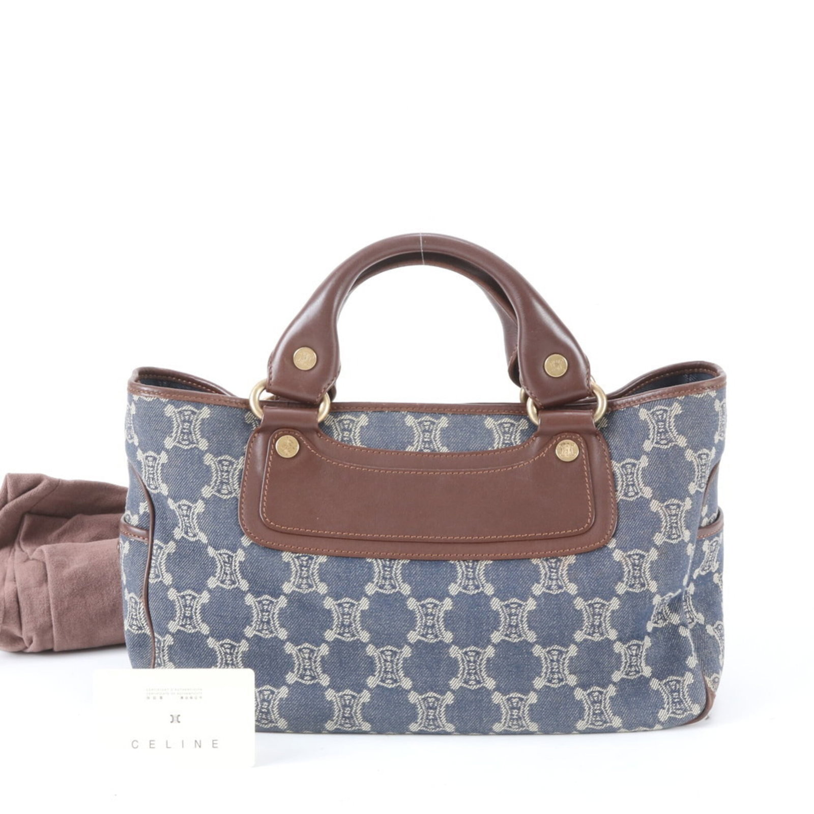 Canvas leather tote bag by Celine: Canvas leather tote bag by Celine Canvas leather tote bag by Celine, featuring a sturdy canvas body and high-quality leather accents in rich brown and navy hues. Measuring 20cm x 33cm x 14cm, this sty