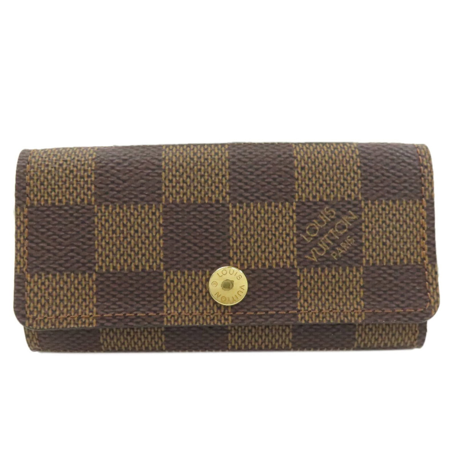Damier canvas keycase by Louis Vuitton: Damier canvas keycase by Louis Vuitton Damier canvas keycase by Louis Vuitton features the iconic Damier pattern in Ebene, a timeless and versatile design. This compact keycase boasts four key hooks a