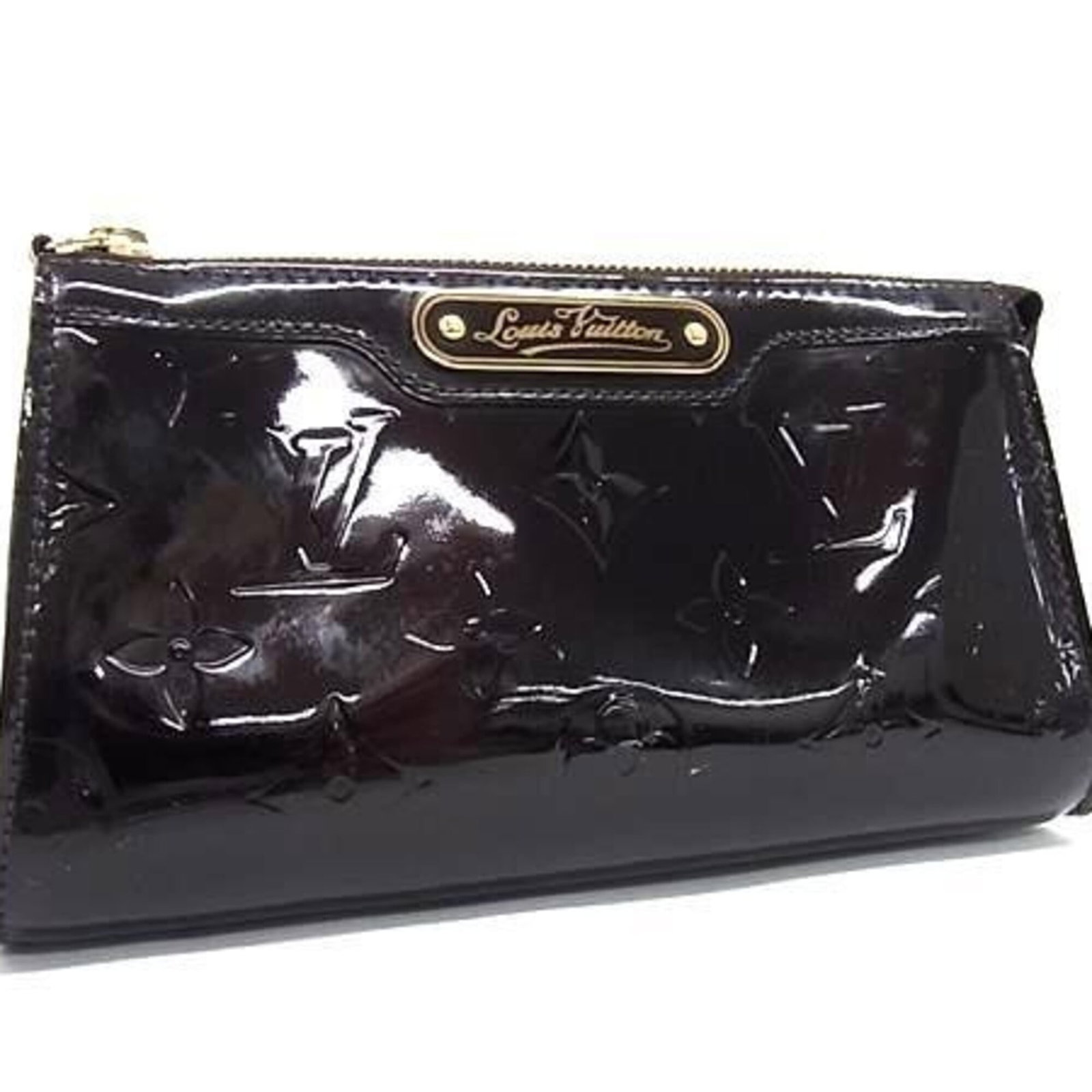 Louis Vuitton Monogram Vernis Pouch: Louis Vuitton Monogram Vernis Pouch Monogram Vernis Pouch from Louis Vuitton, featuring the iconic Amarante color. This stylish pouch boasts the signature Monogram Vernis pattern, adding a touch of lu