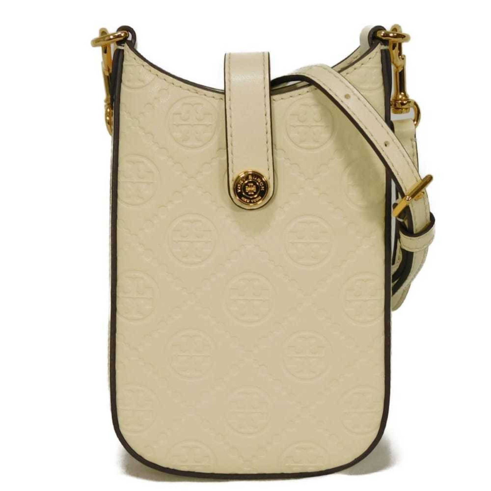 Tory Burch Shoulder Bag Leather: Tory Burch Shoulder Bag Leather The Tory Burch Shoulder Bag Leather boasts a classic cream and white color combination, accented with gold hardware for a touch of sophistication. This stylish bag feat