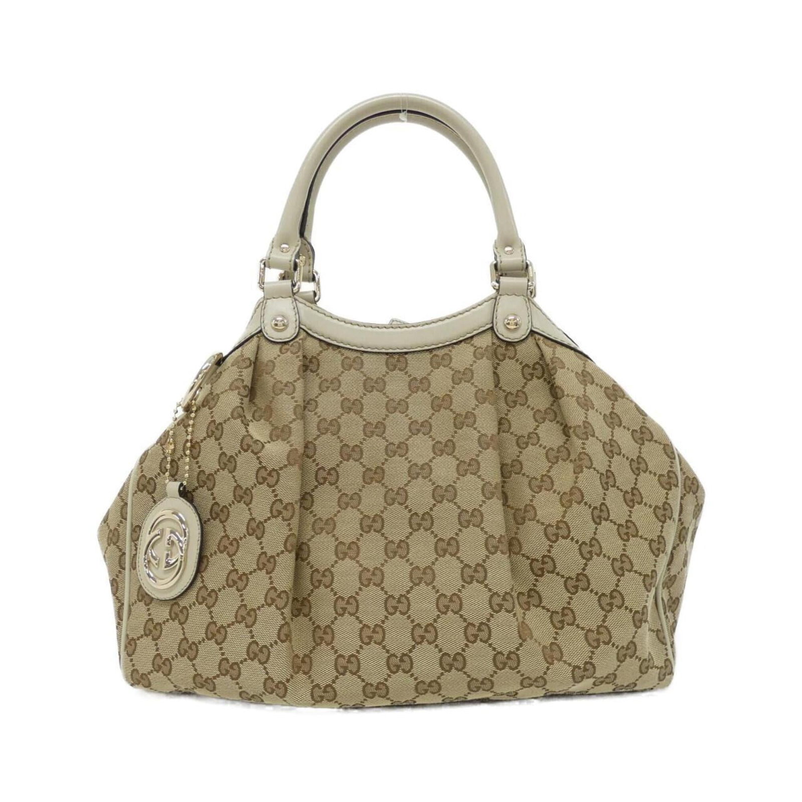 Gucci canvas handbag: Gucci canvas handbag Gucci canvas handbag in beige and ivory, featuring the iconic GG canvas design. This stylish bag measures 26cm x 35cm x 12cm, making it a versatile and compact accessory for every