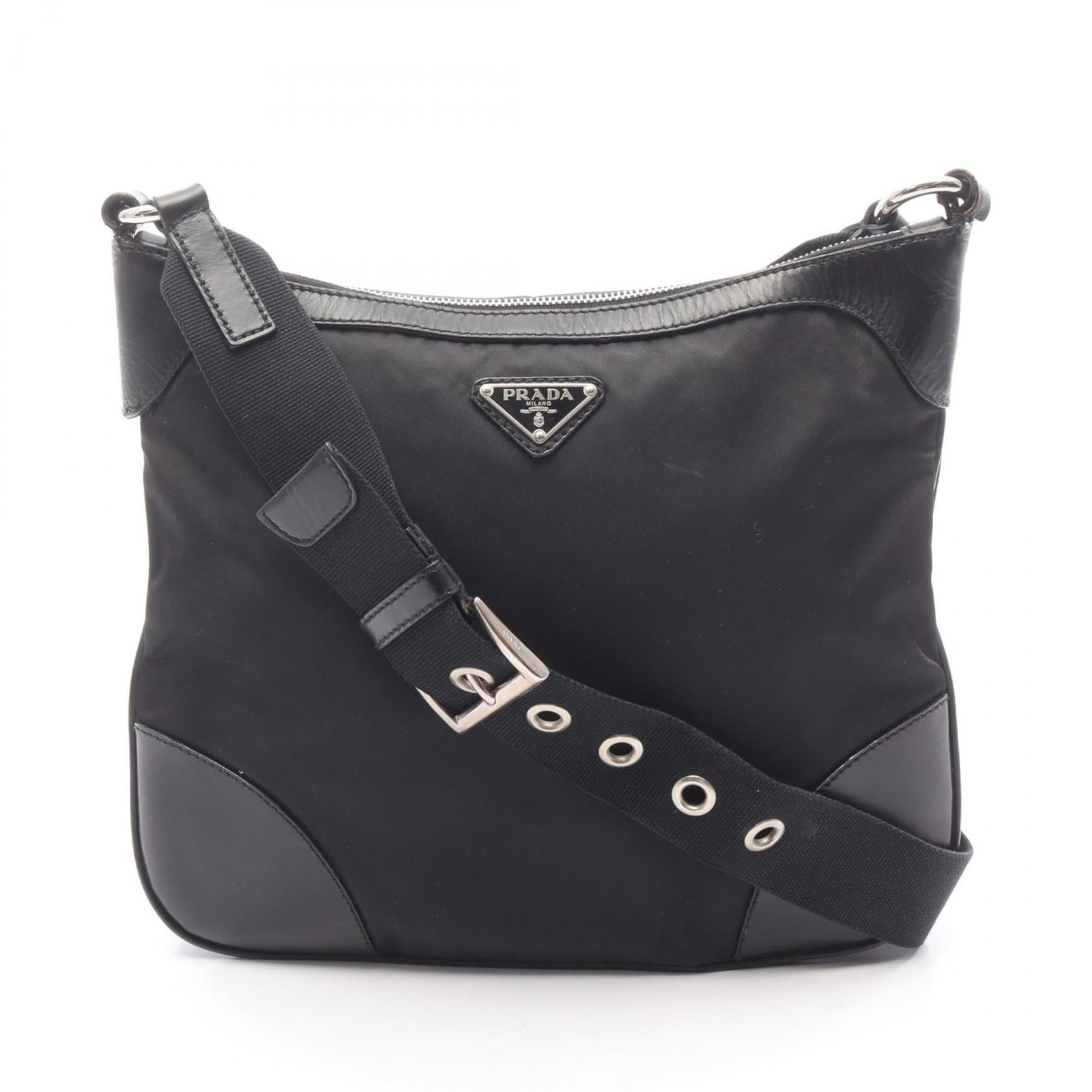 Nylon leather shoulder bag by Prada: Nylon leather shoulder bag by Prada Nylon leather shoulder bag by Prada, featuring a sleek black design with a durable nylon and leather construction. Measuring 25cm x 29cm x 7cm, this stylish accesso