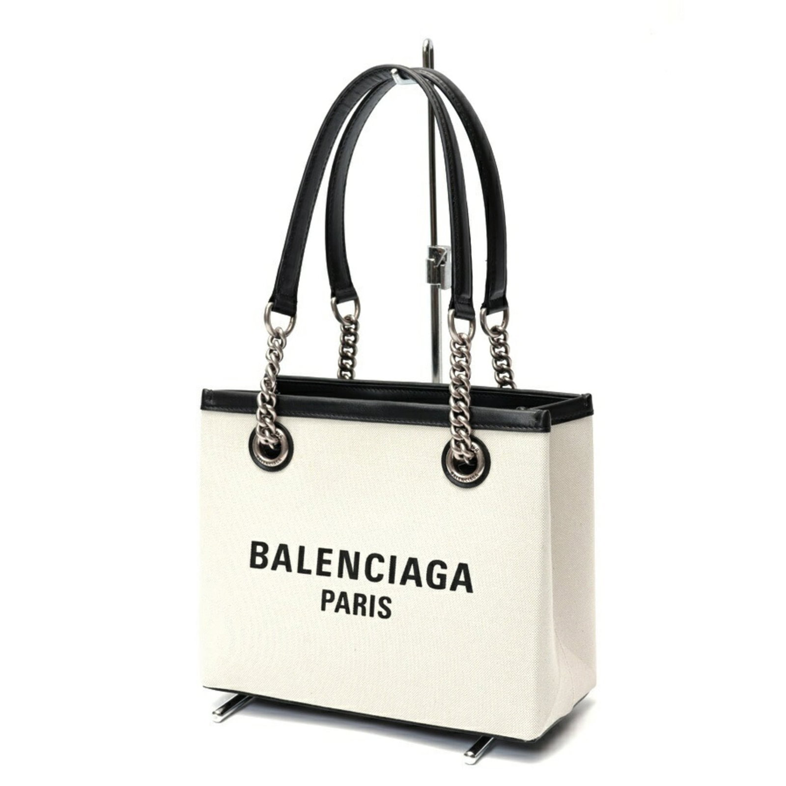 Canvas leather tote bag by Balenciaga: Canvas leather tote bag by Balenciaga Canvas leather tote bag by Balenciaga, featuring a sleek black design made from canvas and leather materials. Measuring 19cm x 23cm x 10.5cm, this stylish tote ba