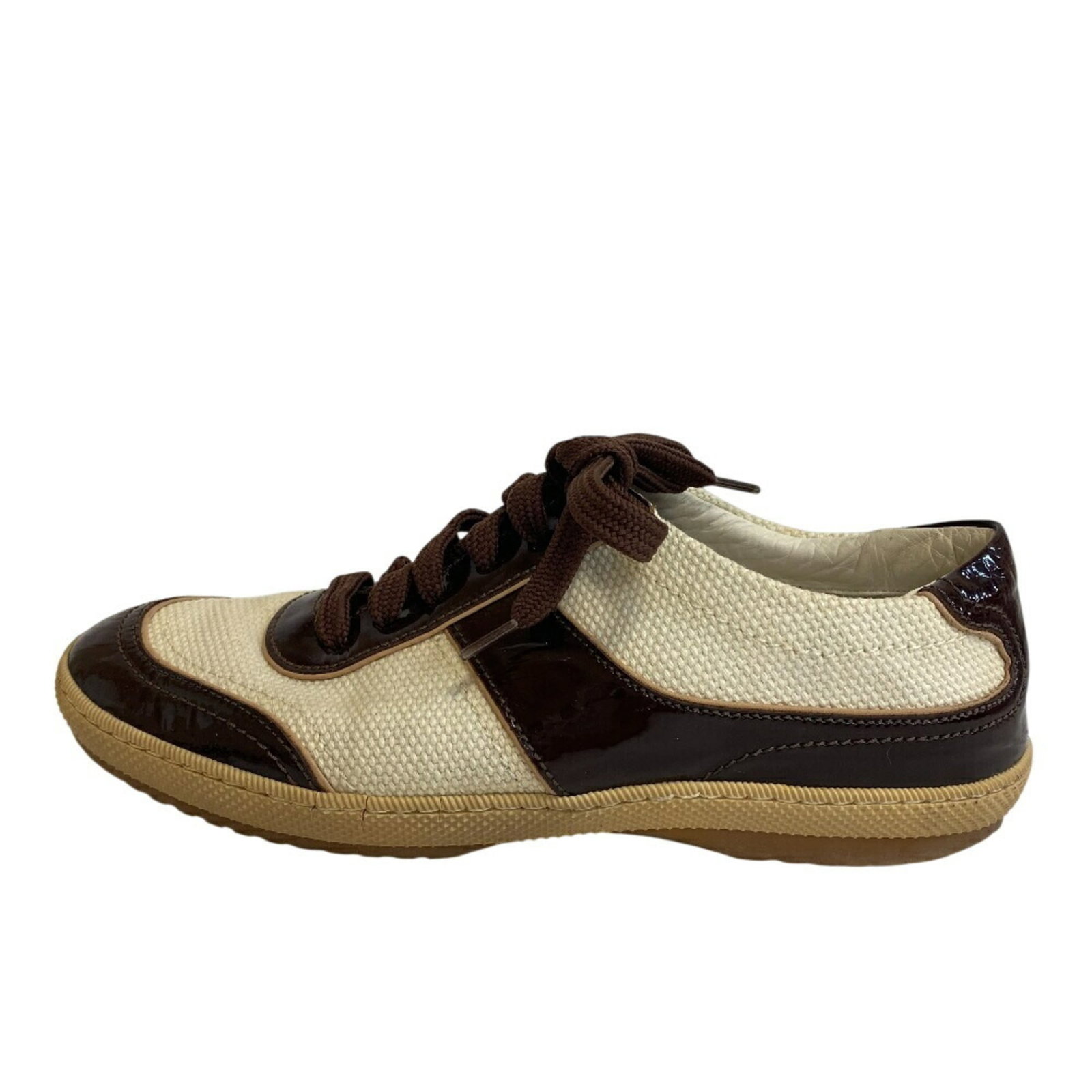 Sneakers By Louis Vuitton: Sneakers By Louis Vuitton Sneakers by Louis Vuitton in Brown and White, featuring patent leather upper, available in US Size 5. Notable for their distinctive design and luxurious material, these sneak
