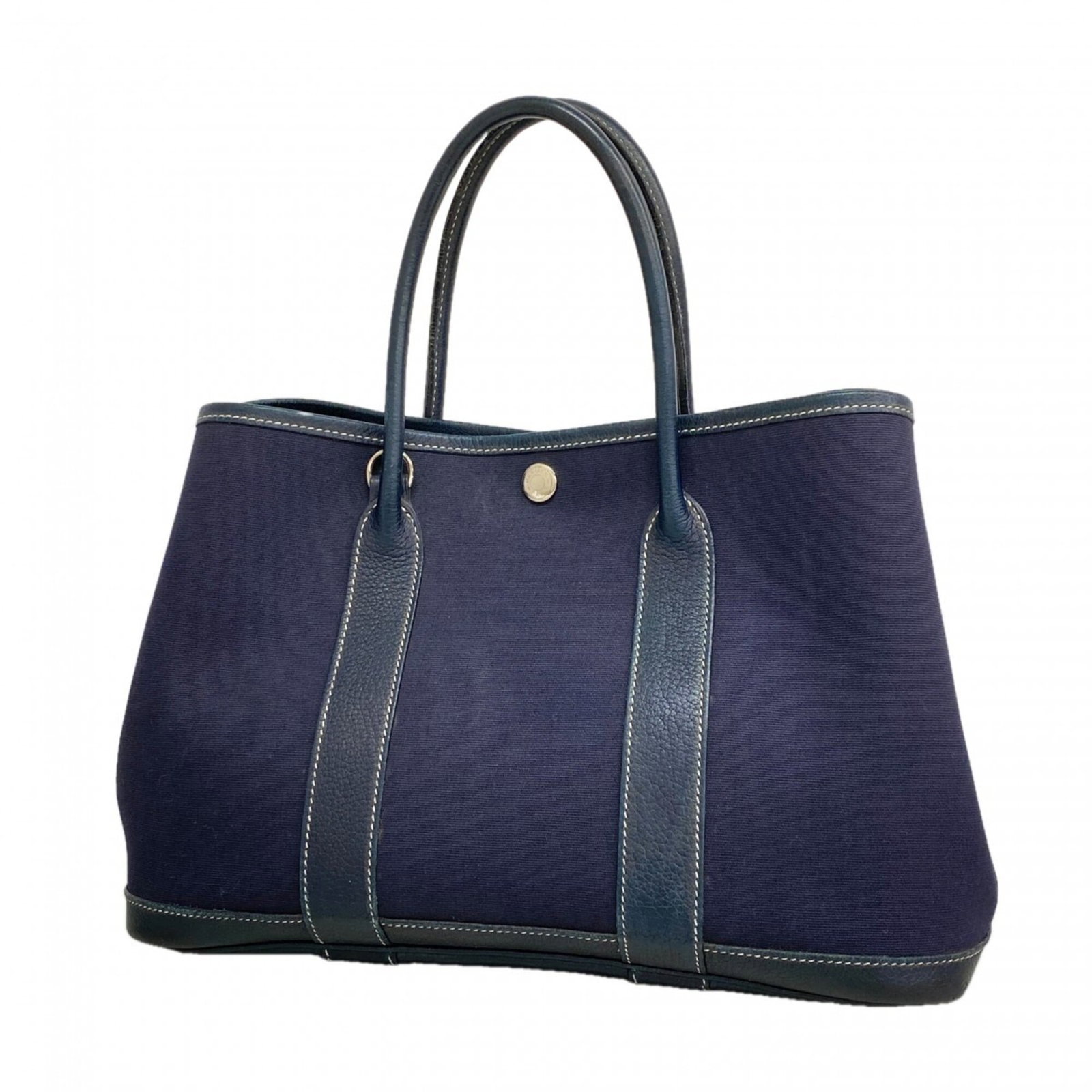 Hermes Handbag Toile Officier: Hermes Handbag Toile Officier Toile Officier handbag from Hermes, featuring navy color and silver hardware. This iconic design measures 20.5cm x 30cm x 13.5cm and showcases the signature Toile Officie