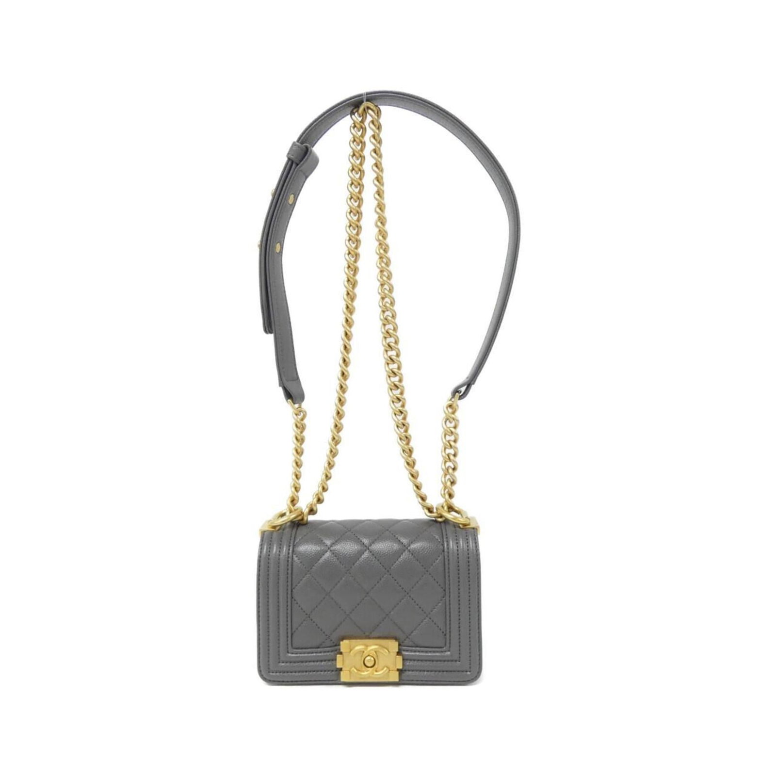 Calfskin Shoulder Bag by Chanel: Calfskin Shoulder Bag by Chanel Grained Calfskin Shoulder Bag by Chanel boasts a sleek, sophisticated design with matte gold hardware. This compact bag measures 10cm x 15cm x 5cm and weighs 410g, maki
