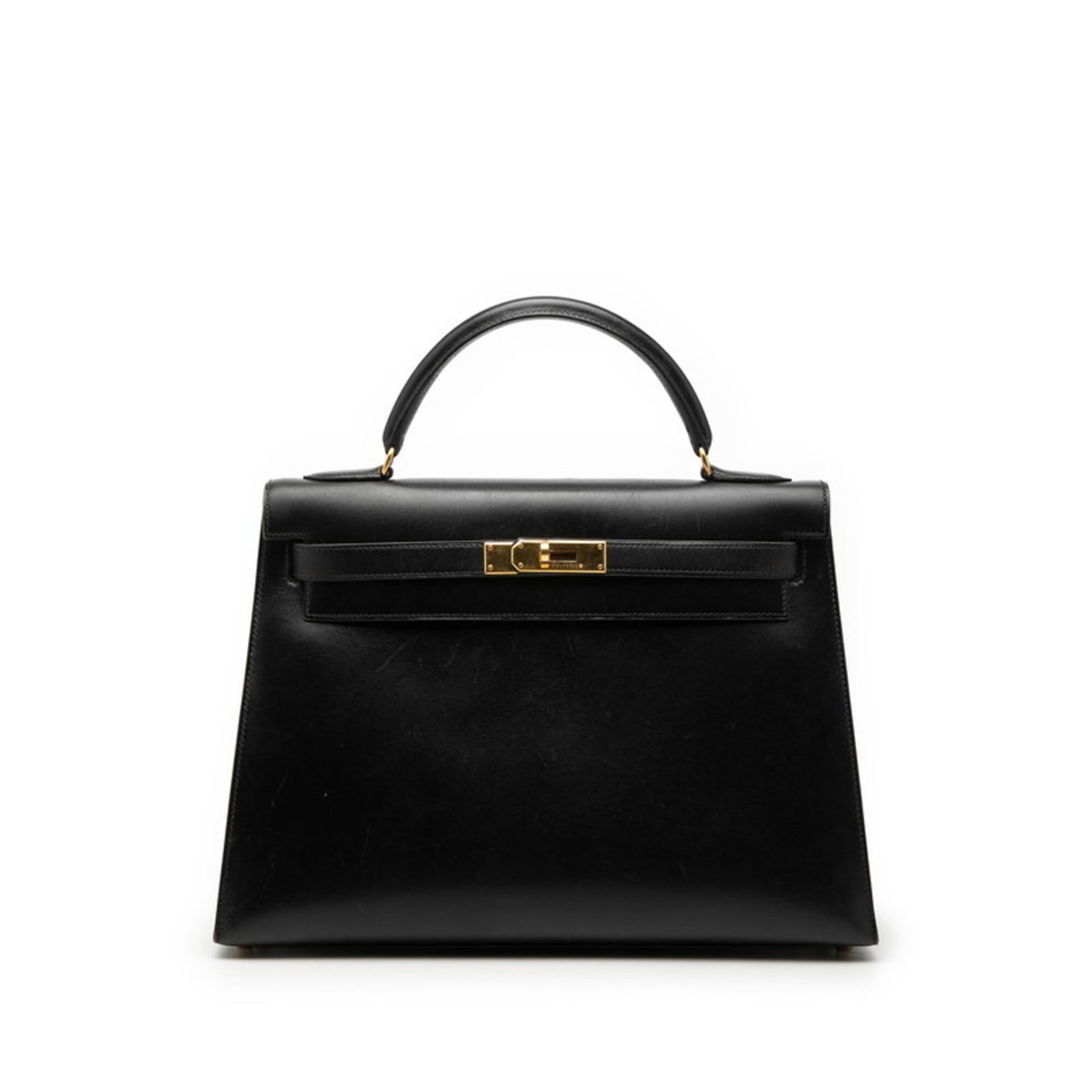Calf Leather Handbag Hermes Box: Calf Leather Handbag Hermes Box Box calf leather construction provides a rich, luxurious feel to this black Hermes handbag. The gold hardware adds a touch of sophistication, while the compact size mak