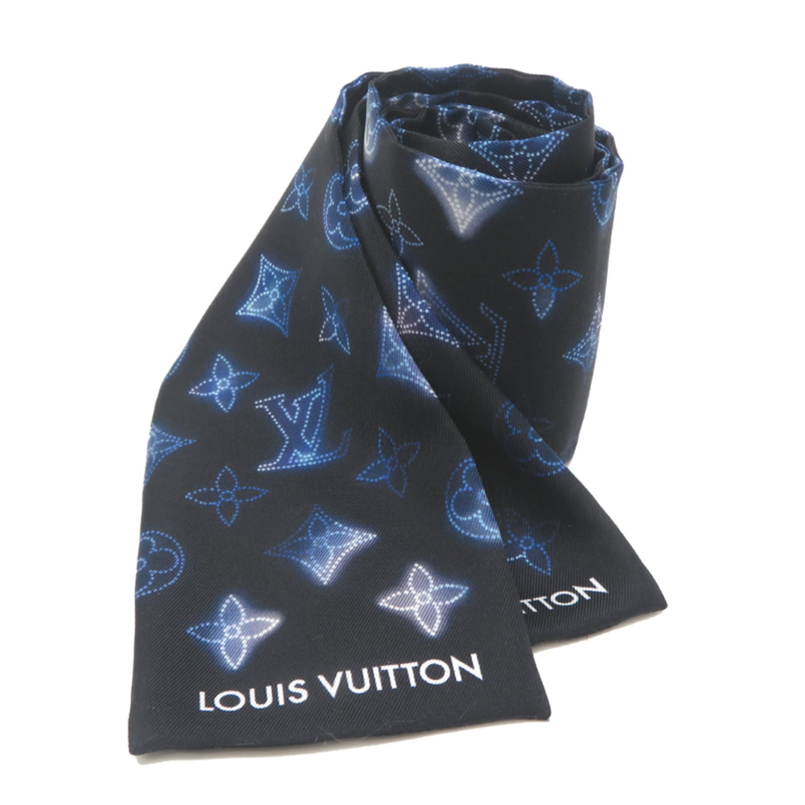 Silk Scarf by Louis Vuitton: Silk Scarf by Louis Vuitton Silk Scarf by Louis Vuitton, crafted from luxurious silk and boasting the iconic monogram pattern. Measuring 1.18m x 8cm, this elegant accessory adds a touch of sophisticat