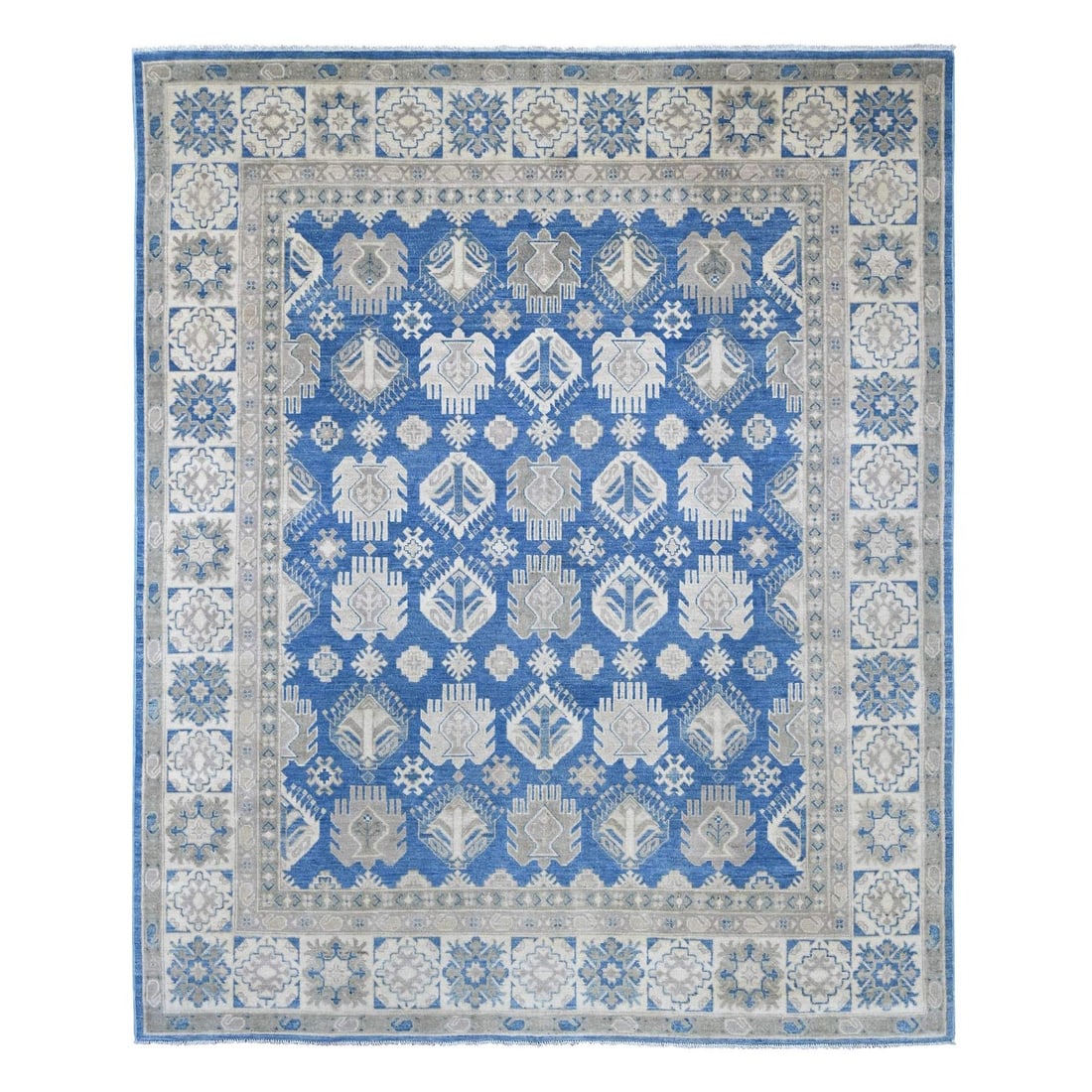 7'10"x9'7" Blue Vintage Look Kazak with Tribal Motif Hand Knotted Wool Rug: 7'10"x9'7" Blue Vintage Look Kazak with Tribal Motif Hand Knotted Wool Rug The 7'10"x9'7" Blue Vintage Look Kazak with Tribal Motif Hand Knotted Wool Rug boasts an all-over regional design, characteri