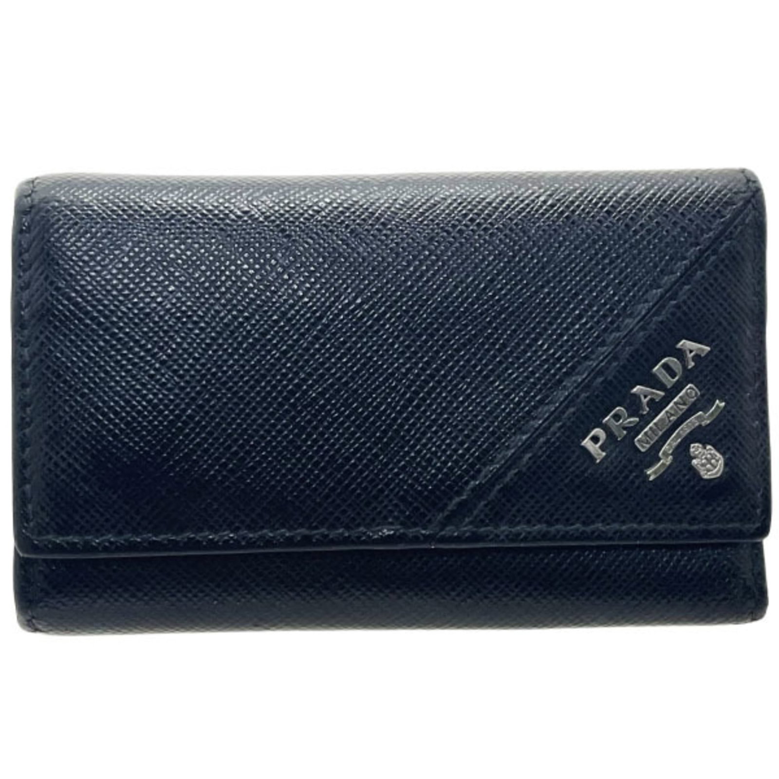 Keycase Saffiano by Prada: Keycase Saffiano by Prada Saffiano leather construction provides durability and style, while the sleek black design fits neatly in any handbag collection. This compact keycase features six secure key 