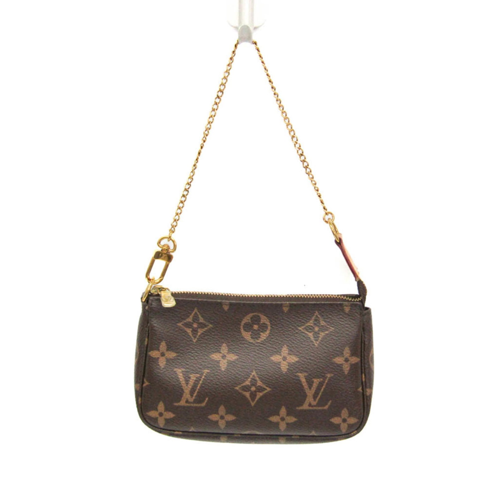 Vuitton Handbag Monogram Louis: Vuitton Handbag Monogram Louis The Louis Vuitton Mini Pochette Monogram M58009 handbag boasts its iconic monogram pattern in rich brown, perfectly balanced by a sleek zipper closure. Measuring just 10