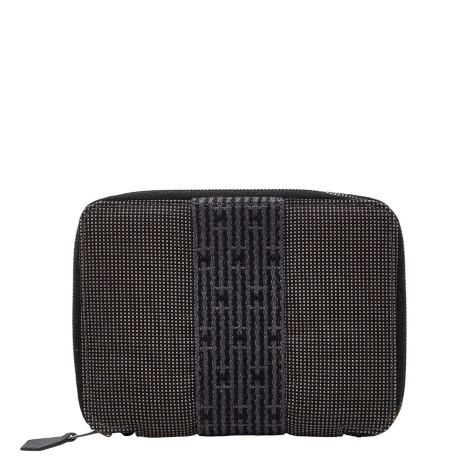 Women's Gray Canvas Hermes Herms Air Planner Agenda Line Cover: Women's Gray Canvas Hermes Herms Air Planner Agenda Line Cover Gray canvas Hermes planner agenda line cover, featuring the iconic brand's signature design. Made from high-quality canvas material, this