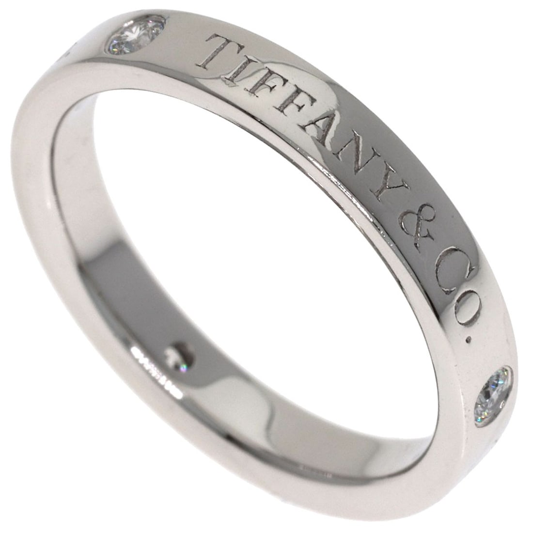 Tiffany&Co. Flat Band Diamond Ring Platinum Pt950: Tiffany&Co. Flat Band Diamond Ring Platinum Pt950 Tiffany&Co.'s Flat Band Diamond Ring in Platinum Pt950 boasts a sleek, silver metal design with a striking flat band that showcases its main stone. Th