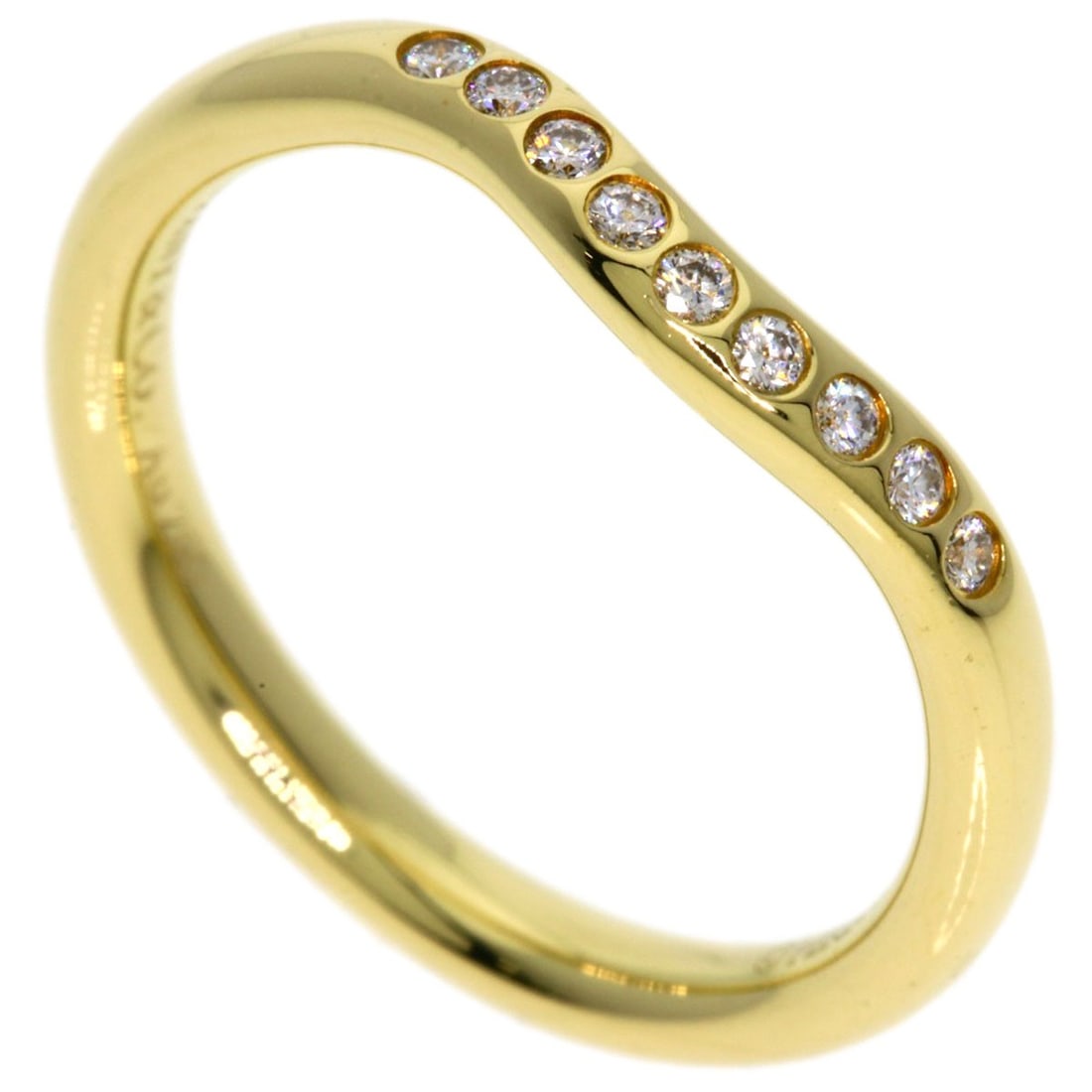 K18 Yellow Gold Diamond Curved Band Ring by Tiffany&Co: K18 Yellow Gold Diamond Curved Band Ring by Tiffany&Co K18 Yellow Gold Diamond Curved Band Ring by Tiffany&Co. boasts a striking curved design, showcasing a diamond set in K18 yellow gold. The ring's 