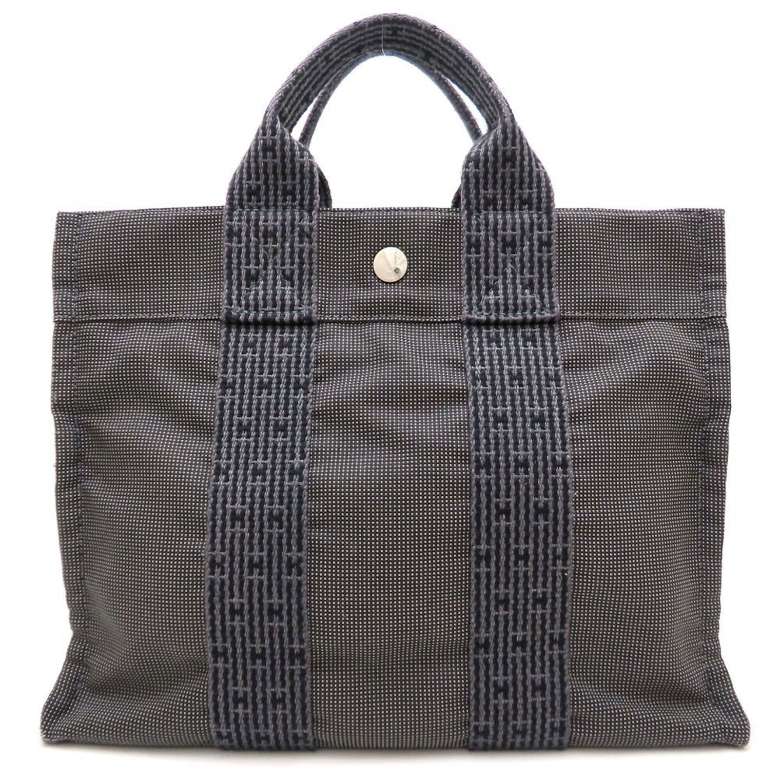 Hermes Handbag Nylon Canvas: Hermes Handbag Nylon Canvas This Hermes Handbag Nylon Canvas features a sturdy gray color and measures 23cm x 30cm x 8cm. Made from high-quality nylon canvas, it boasts a unique design that showcases 