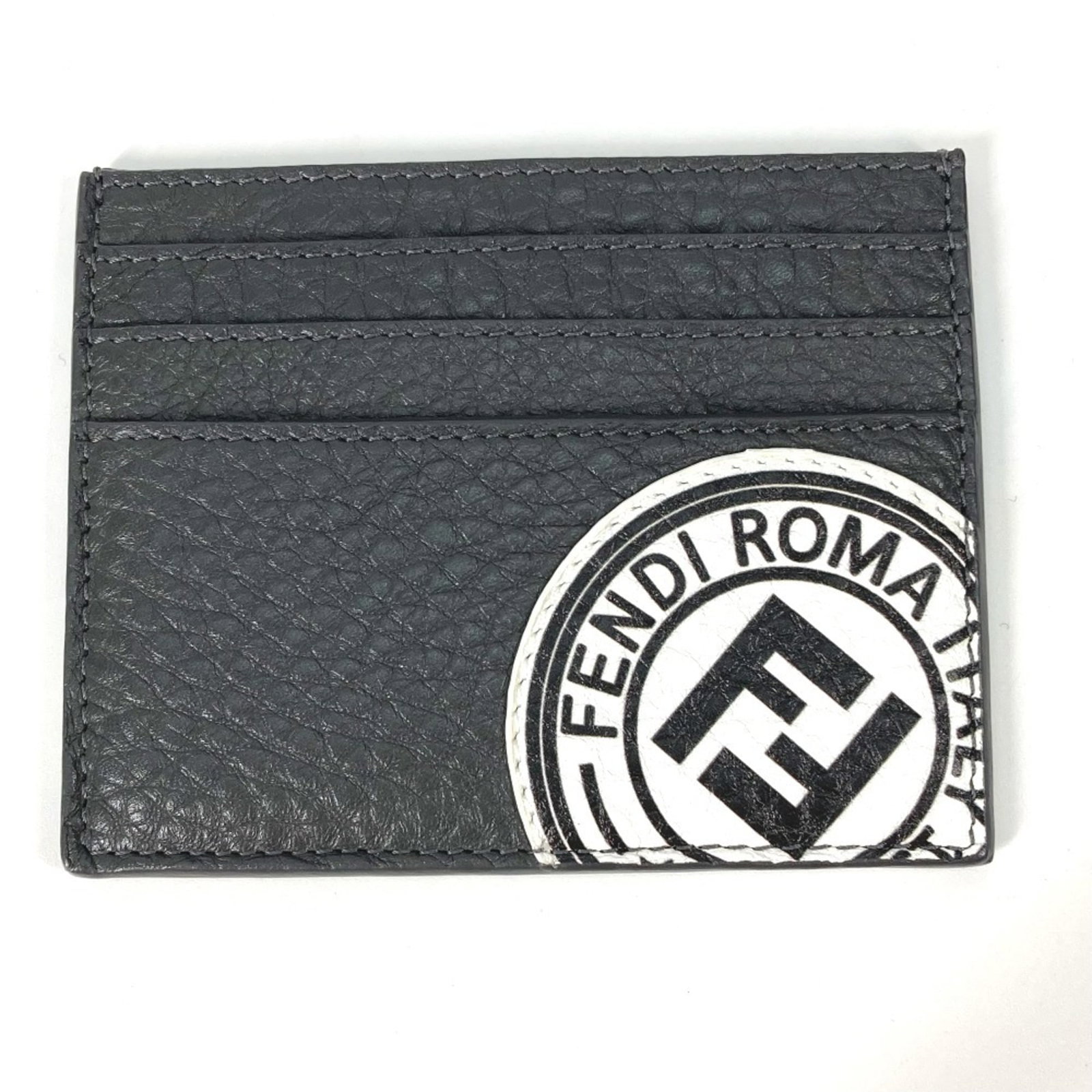 Case Fendi Card Leather: Case Fendi Card Leather The Fendi Card Leather case boasts sleek, modern design with its gray and white color combination. Made from high-quality leather, the compact size (8cm x 10cm) makes it a vers