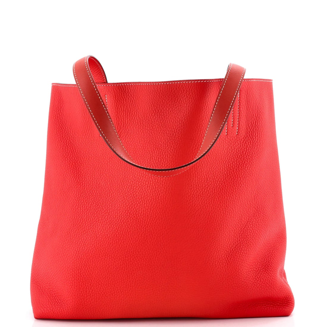 Swift Clemence and Hermes Double Sens Tote: Swift Clemence and Hermes Double Sens Tote Red Clemence and Swift Double Sens Tote by Hermes features a classic design with a bold exterior color. Made from high-quality leather, the tote boasts a tim