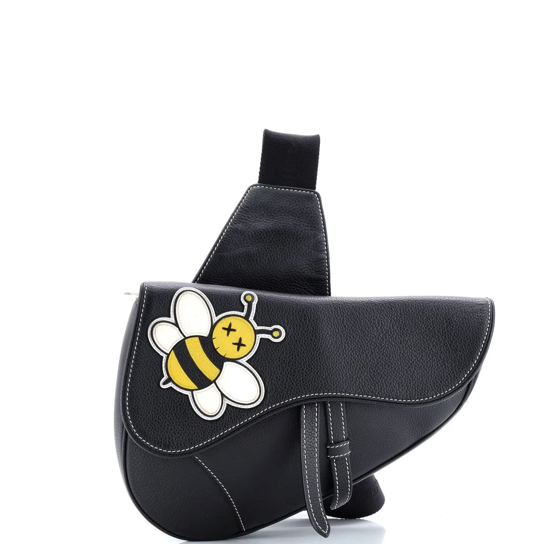 KAWS Leather Saddle Crossbody Bag Christian Dior with Applique: KAWS Leather Saddle Crossbody Bag Christian Dior with Applique Christian Dior's KAWS Saddle Crossbody Bag boasts sleek, black leather exterior adorned with an eye-catching applique. This stylish bag m