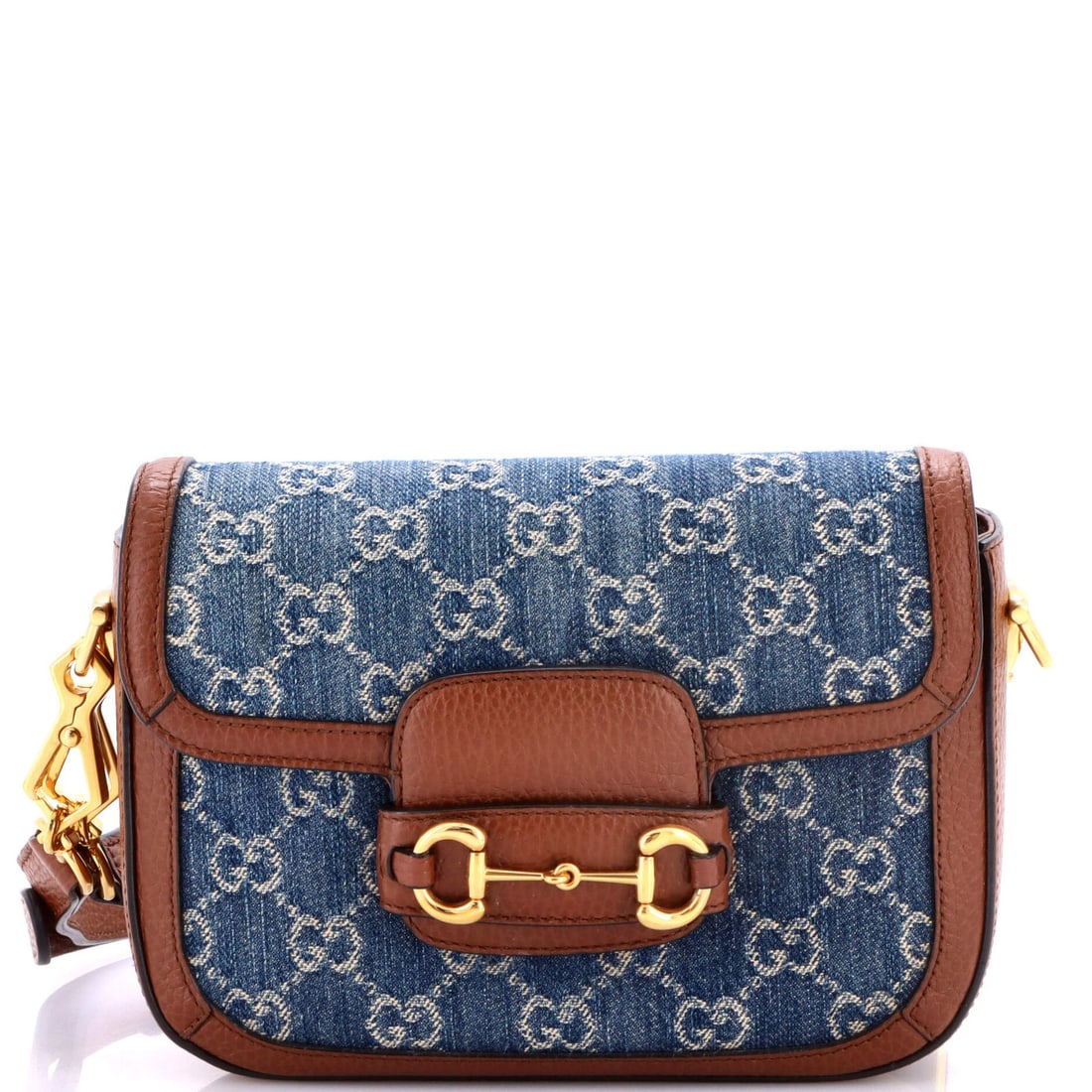Gucci Horsebit Bag 1955 Mini GG Denim: Gucci Horsebit Bag 1955 Mini GG Denim The Gucci Horsebit Bag 1955 Mini GG Denim boasts a striking blue denim exterior, characteristic of the iconic GG pattern. Measuring just 6" tall and 8" wide,