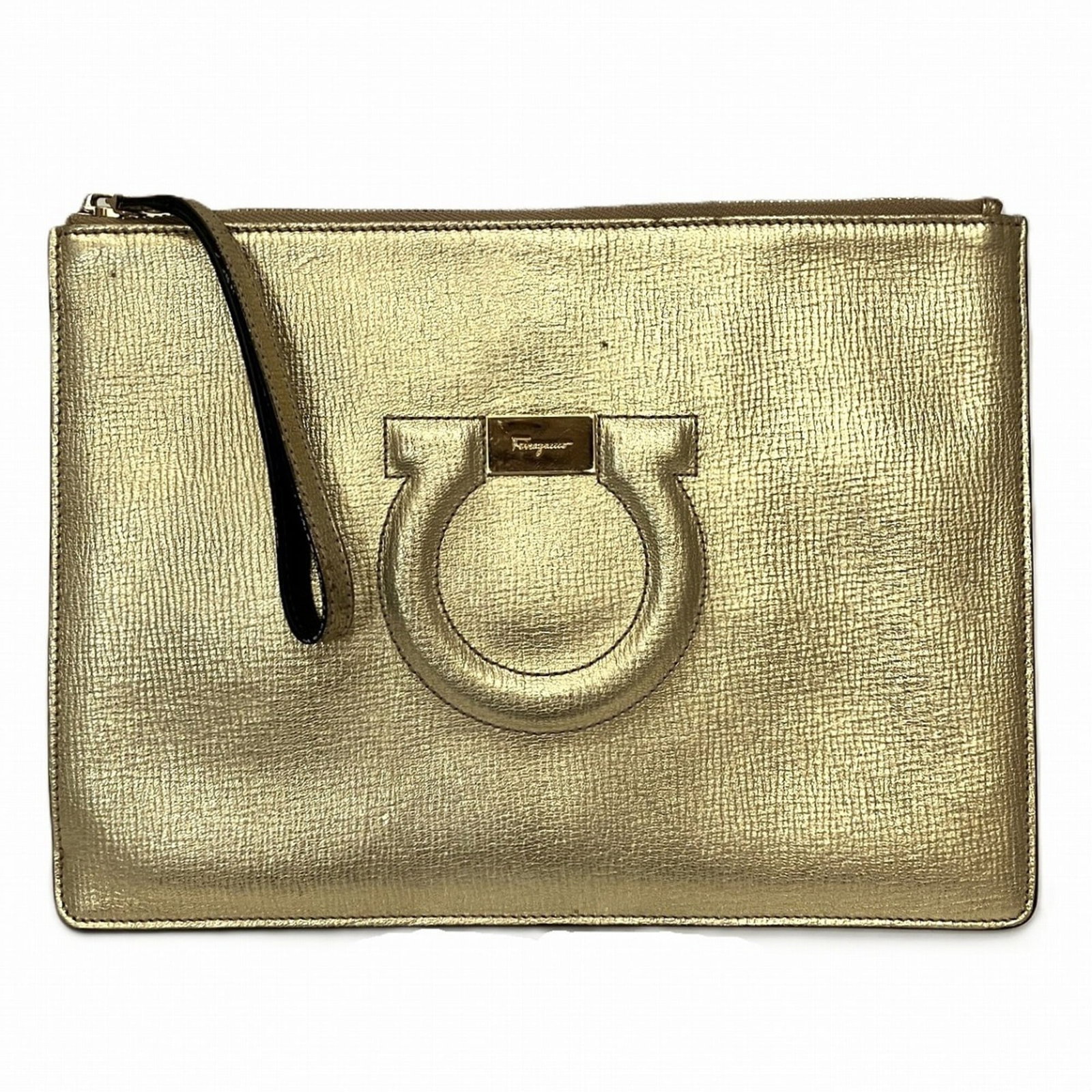 Bag Clutch Salvatore Ferragamo Leather: Bag Clutch Salvatore Ferragamo Leather Gold Leather Salvatore Ferragamo Gancini Clutch Bag. This sleek, gold leather clutch features a zipper closure and measures 19cm x 27cm x 1cm. Its classic design