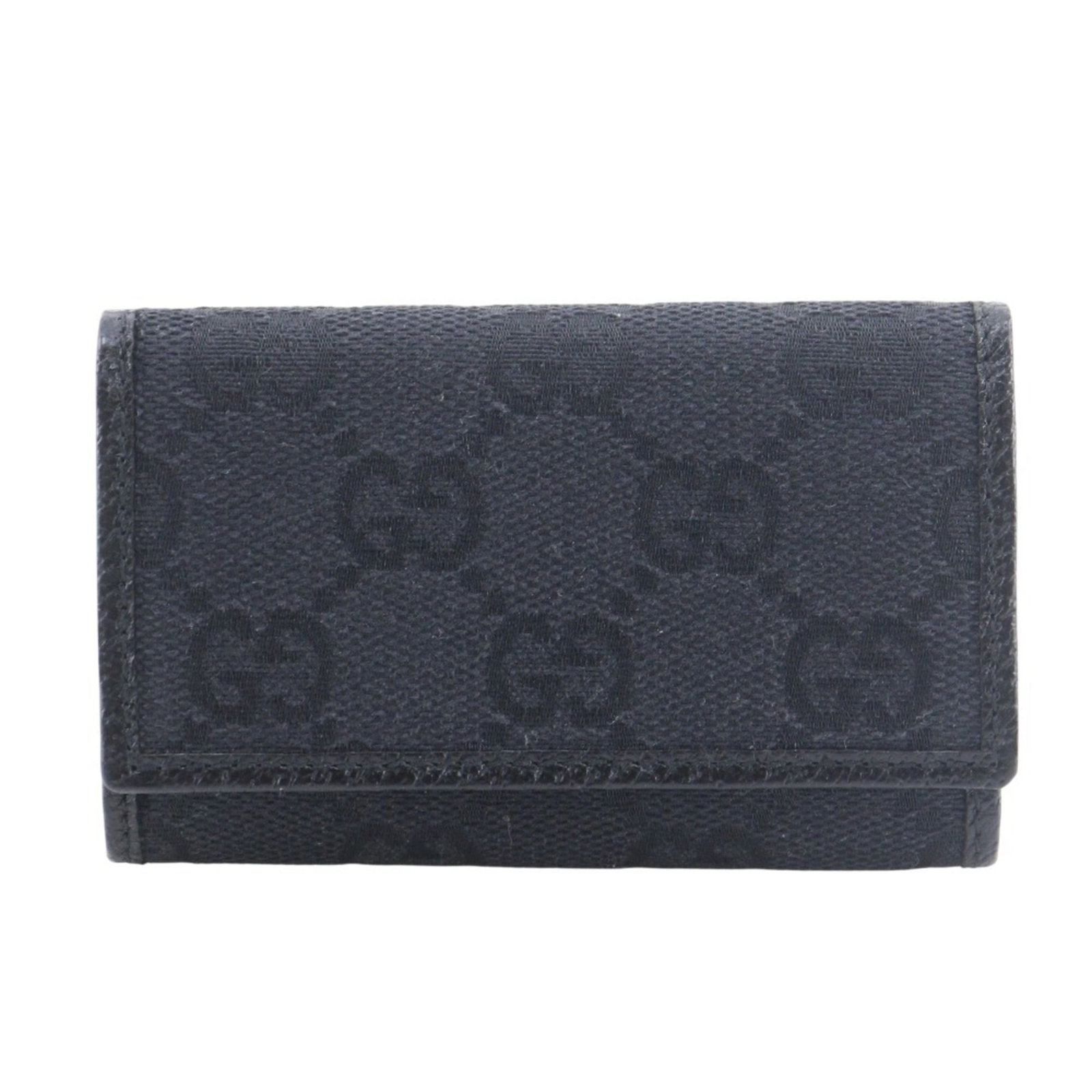 Keycase By Gucci Canvas: Keycase By Gucci Canvas Black GG canvas keycase by Gucci, measuring 6cm x 9.5cm x 1.5cm, features the iconic brand's signature style. Made from high-quality canvas material, this compact keychain is a