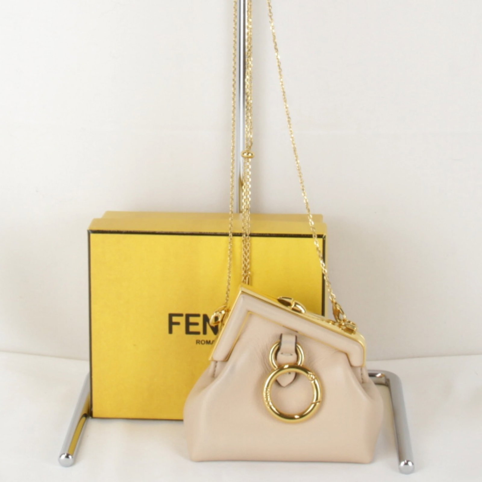 Fendi Coin Case Purse: Fendi Coin Case Purse The Fendi Coin Case Purse boasts sleek design and compact size, measuring 9cm x 9cm x 4.5cm. Its magnet closure ensures secure fastening, while its premium materials give it a so