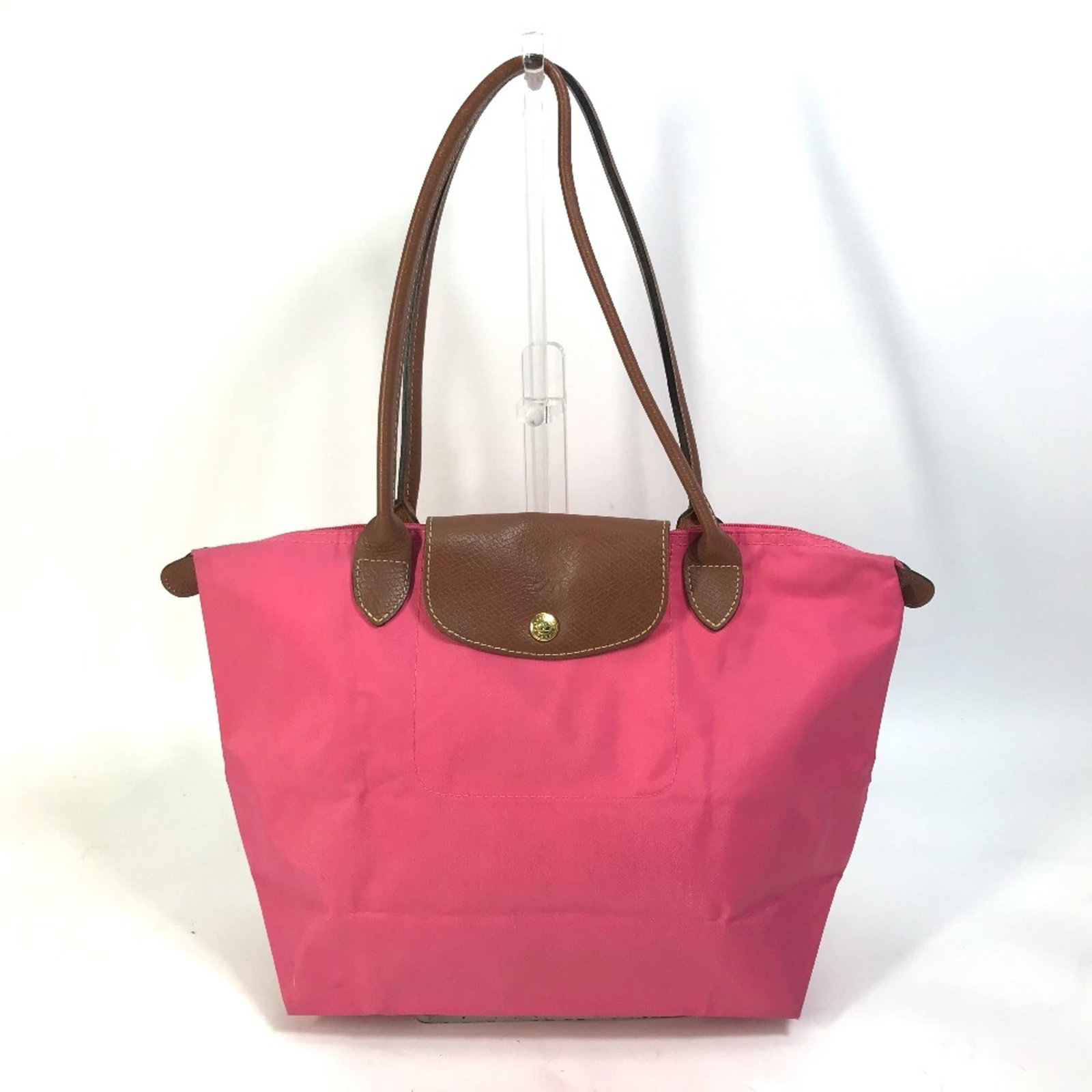 Tote Bag Cloth Longchamp: Tote Bag Cloth Longchamp Women's Longchamp Tote Bag in Pink. Made from cloth, this bag measures 24.5cm x 23.5cm x 13cm and features a pink color. The signature is present on the item. Item Specifics: 