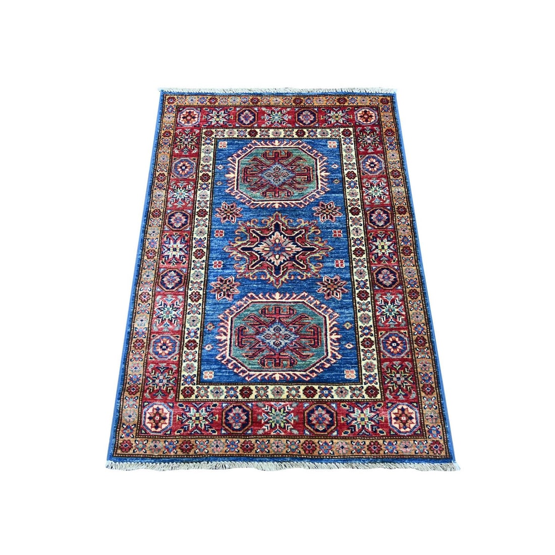 2'9"x4' Blue Afghan Super Kazak Medallion Design Hand Knotted Wool Mat Rug: 2'9"x4' Blue Afghan Super Kazak Medallion Design Hand Knotted Wool Mat Rug Hand-knotted wool mat rug with an intricate blue Afghan Super Kazak medallion design, measuring 2'9"x4', adds a touch of vibr