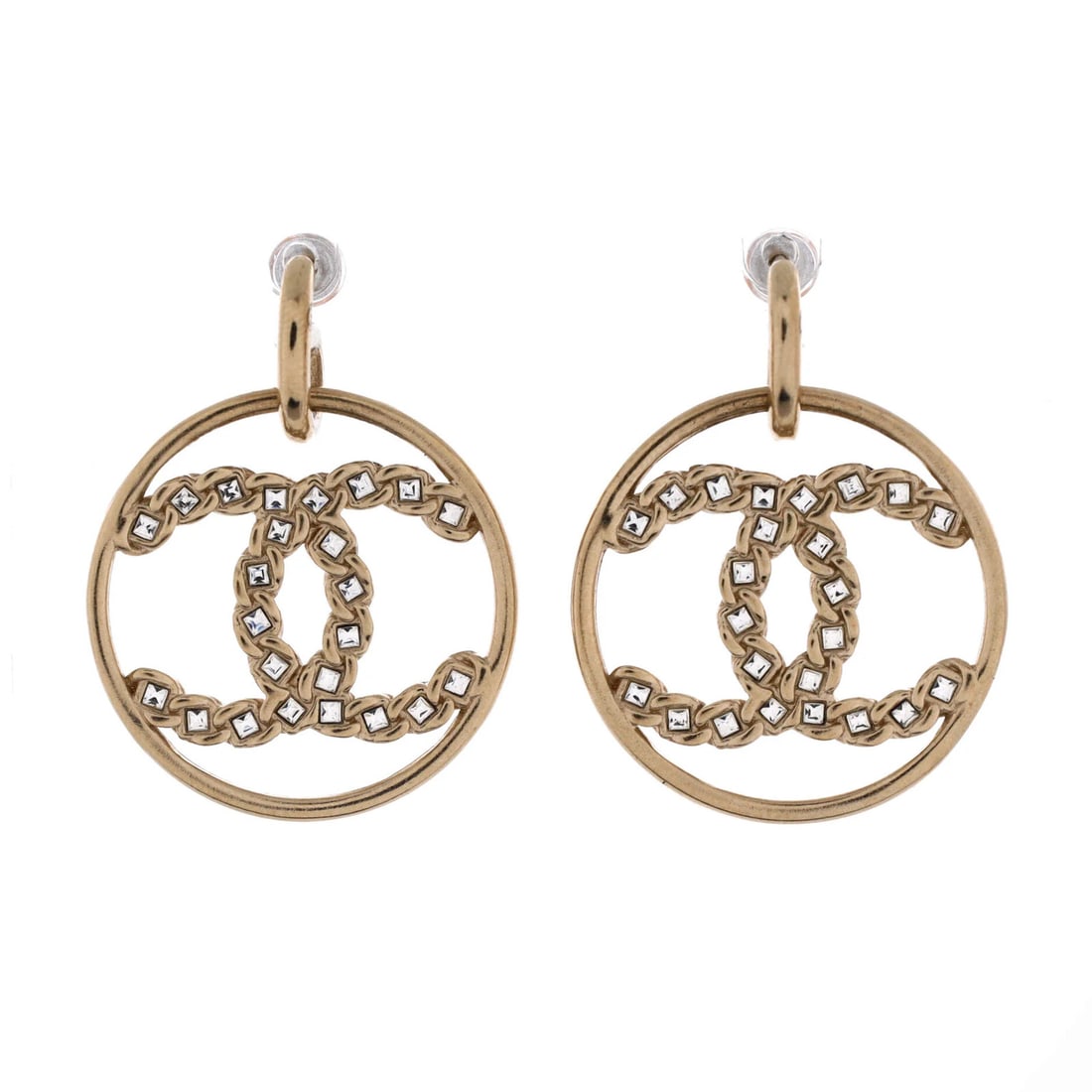 Chanel High Society CC Dangle Hoop Earrings Metal with Crystals: Chanel High Society CC Dangle Hoop Earrings Metal with Crystals Chanel's iconic High Society CC Dangle Hoop Earrings shine in gold, adorned with crystals. Measuring 1.25" in height and 1.2" in width, 