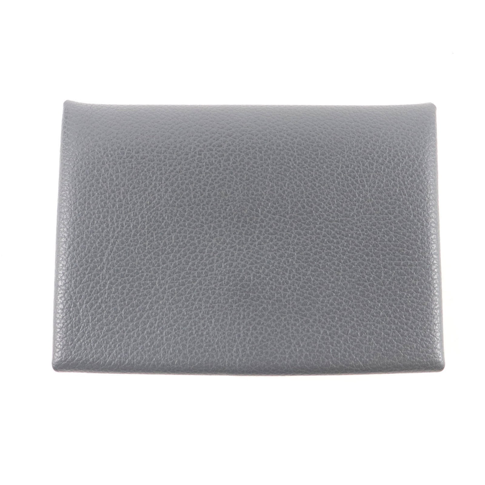 Hermes Coin Purse/ Coin Case Evercalf Leather: Hermes Coin Purse/ Coin Case Evercalf Leather Dark gray Evercalf leather coin purse/coin case from Hermes, measuring 7cm x 10.5cm / 2.75'' x 4.13''. This compact accessory showcases the timeless elega
