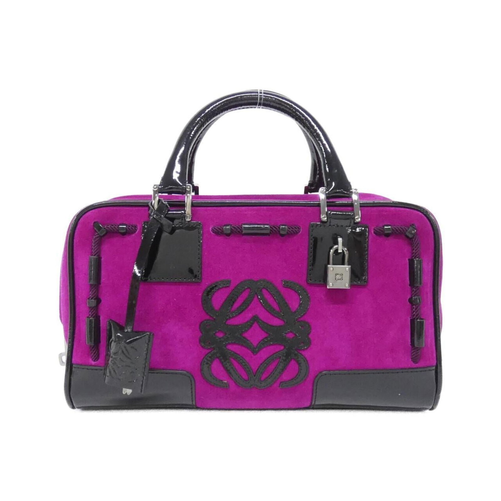 Handbag Leather from Loewe: Handbag Leather from Loewe This exquisite handbag from Loewe boasts rich, deep purple leather with elegant enamel accents. The sleek design and premium materials come together in a sophisticated acces