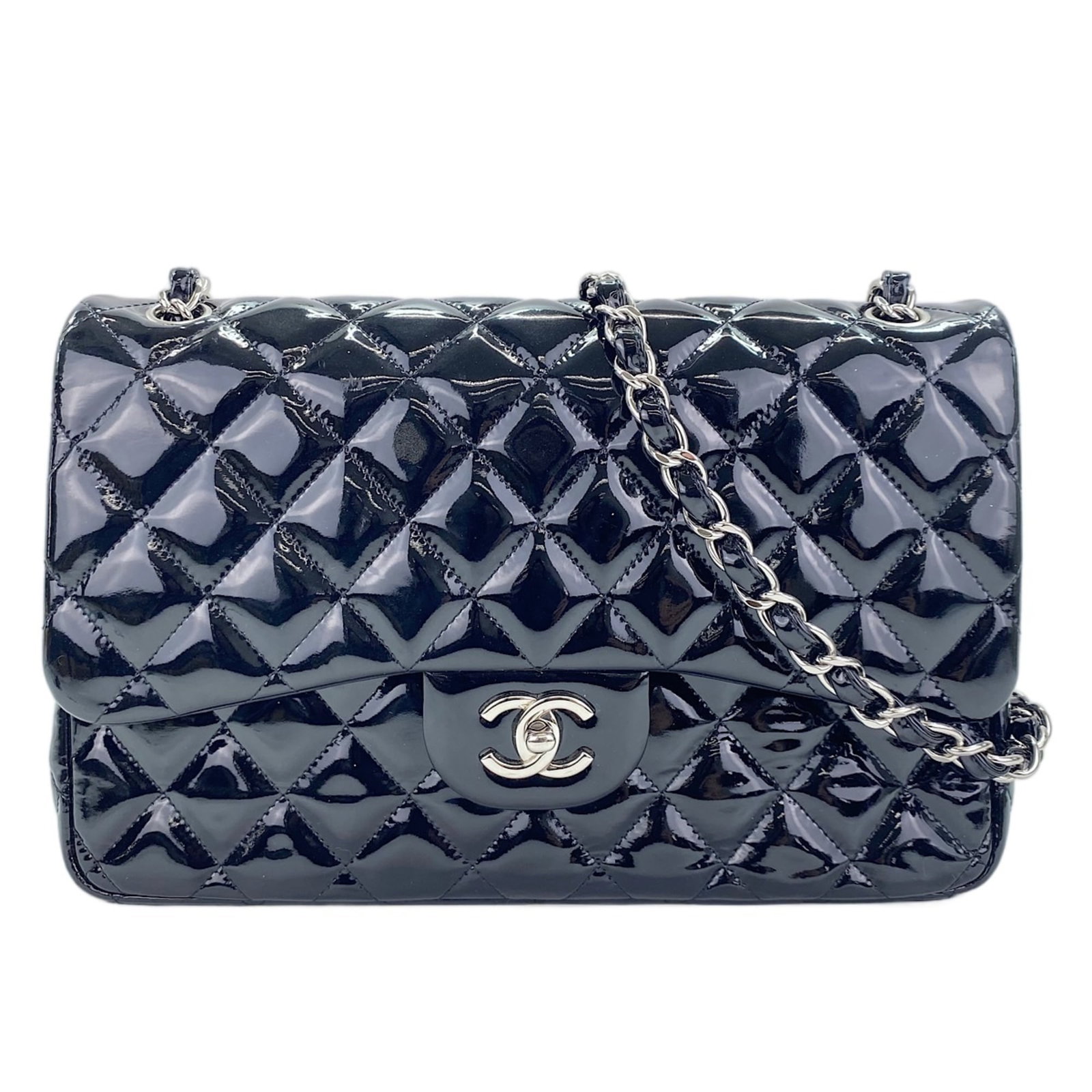 Shoulder Bag by Chanel: Shoulder Bag by Chanel This black Chanel shoulder bag features a sleek design with a 20cm x 30cm x 9cm size, making it a stylish and practical accessory. The classic style and timeless color will comp