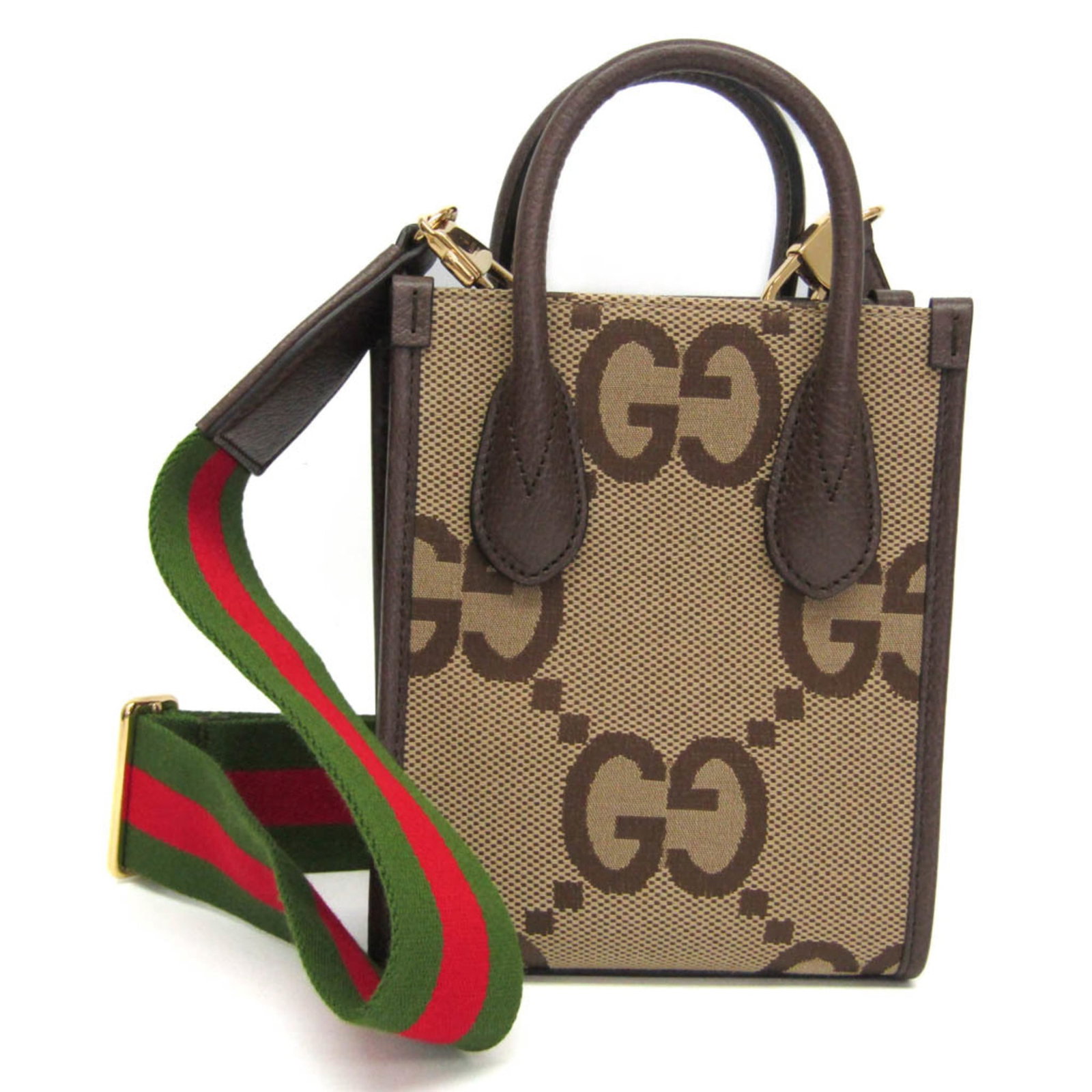 Canvas leather handbag shoulder gucci bag: Canvas leather handbag shoulder gucci bag Canvas leather Gucci bag with adjustable strap, open pocket, and gold hardware. This beige and dark brown Jumbo GG Mini shoulder bag features a classic design