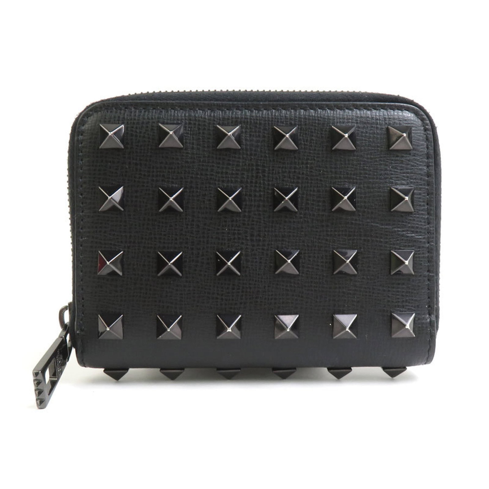 Valentino Garavani Coin Purse/ Coin Case Leather: Valentino Garavani Coin Purse/ Coin Case Leather The Valentino Garavani Coin Purse/ Coin Case Leather is a sleek and sophisticated accessory, crafted from high-quality black leather. Measuring 8cm x 1