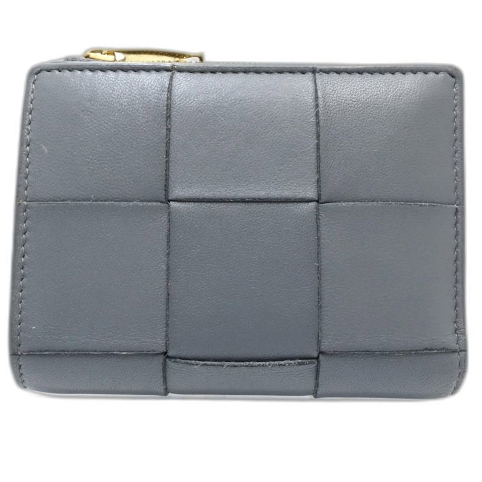 Leather Bi Fold Wallet From Bottega: Leather Bi Fold Wallet From Bottega Bottega Veneta's leather bi-fold wallet boasts sleek, sophisticated design with clean lines and subtle texture. Made from high-quality Italian leather, its compact 