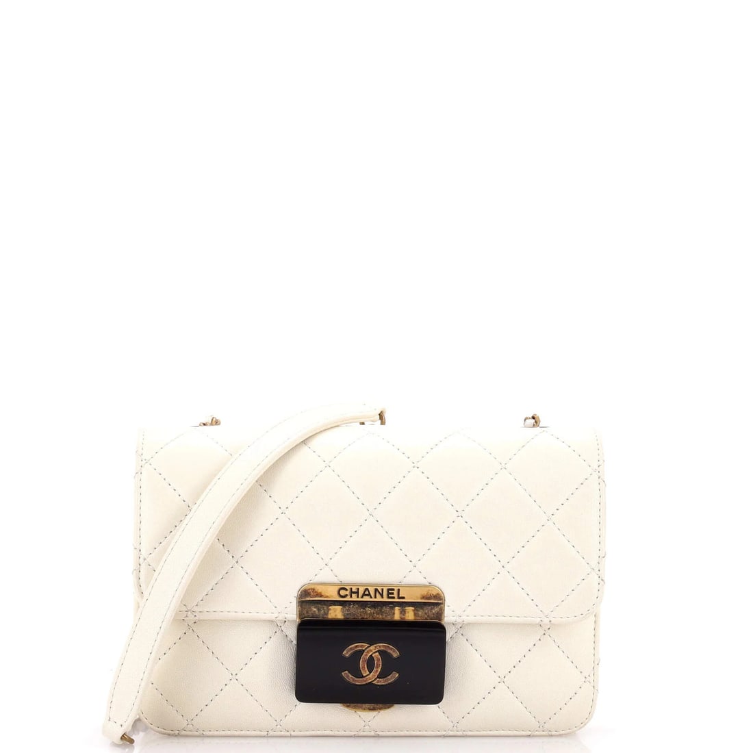 Mini quilted bag beauty sheepskin flap lock Chanel: Mini quilted bag beauty sheepskin flap lock Chanel Neutral-colored leather mini quilted bag with a sheepskin flap lock, featuring a Beauty Lock Flap design and aged gold hardware. This cross-body bag 