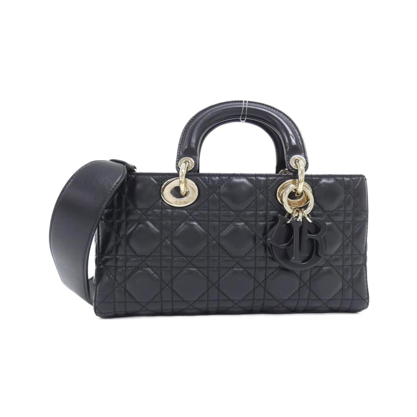 Handbag Christian Dior Leather: Handbag Christian Dior Leather The Christian Dior leather handbag boasts sleek lines and sophisticated style, crafted from high-quality lambskin in a timeless black finish. Measuring 13cm x 25.5cm x 5