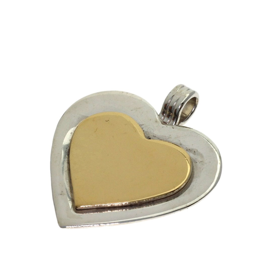 Tiffany&Co. Heart Two-Tone Pendant Top Silver 18K Yellow Gold: Tiffany&Co. Heart Two-Tone Pendant Top Silver 18K Yellow Gold Silver Tiffany&Co. Heart Two-Tone Pendant Top with a sleek design, featuring a top silver setting and an 18K yellow gold base. This elegan