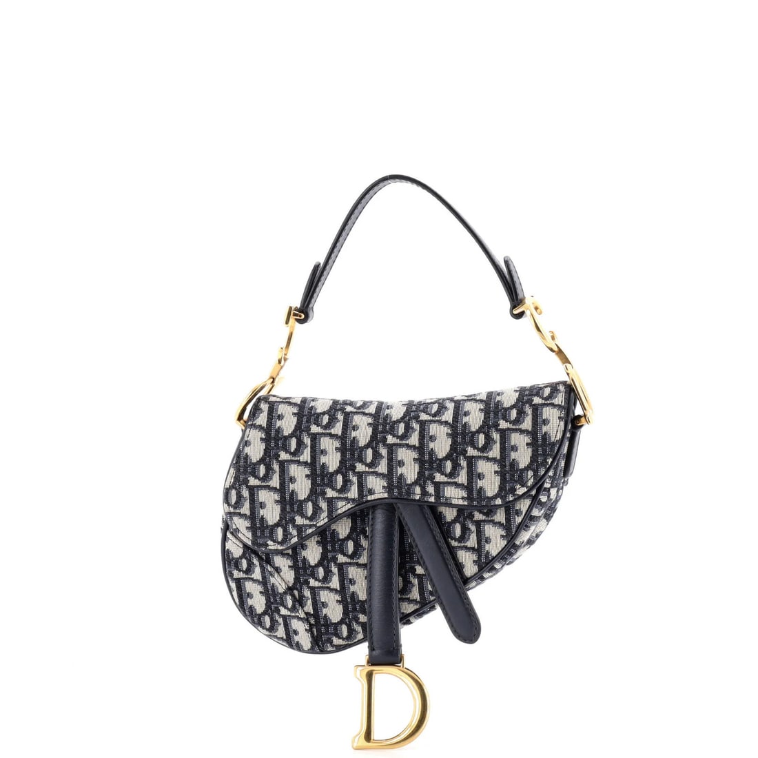 Canvas mini handbag saddle Oblique Christian Dior: Canvas mini handbag saddle Oblique Christian Dior Canvas mini handbag saddle Oblique Christian Dior features a striking blue canvas exterior with neutral interior, adorned with aged gold hardware. The