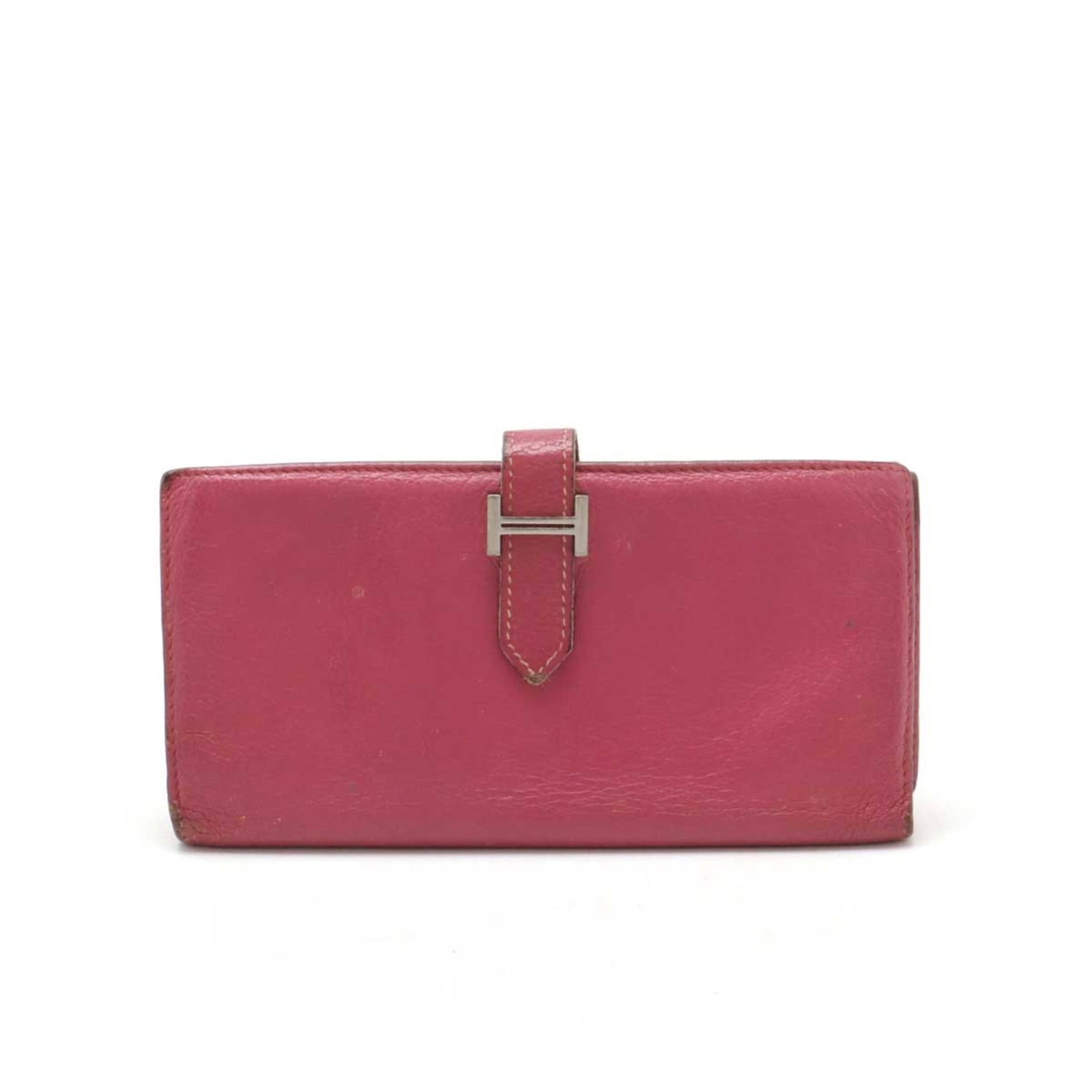 Hermes Leather Tri Fold Wallet: Hermes Leather Tri Fold Wallet The Hermes Leather Tri Fold Wallet boasts a sleek, pink design with a classic tri-fold layout. Made from high-quality leather, its compact size makes it easy to carry. S