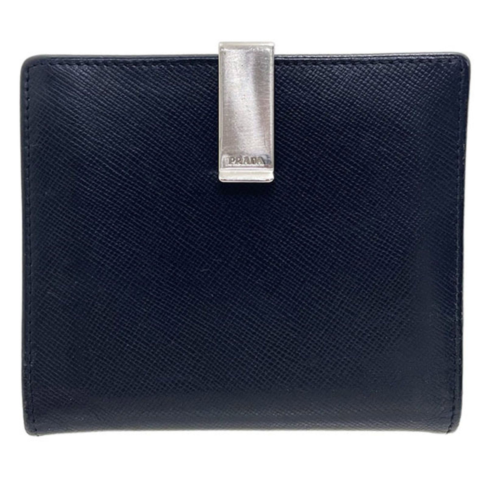 Prada Wallet (Bi-Fold) Leather: Prada Wallet (Bi-Fold) Leather Black bi-fold leather wallet from Prada, made with embossed calf leather and Saffiano leather. The sleek design features a compact size that fits perfectly in a pocket. 