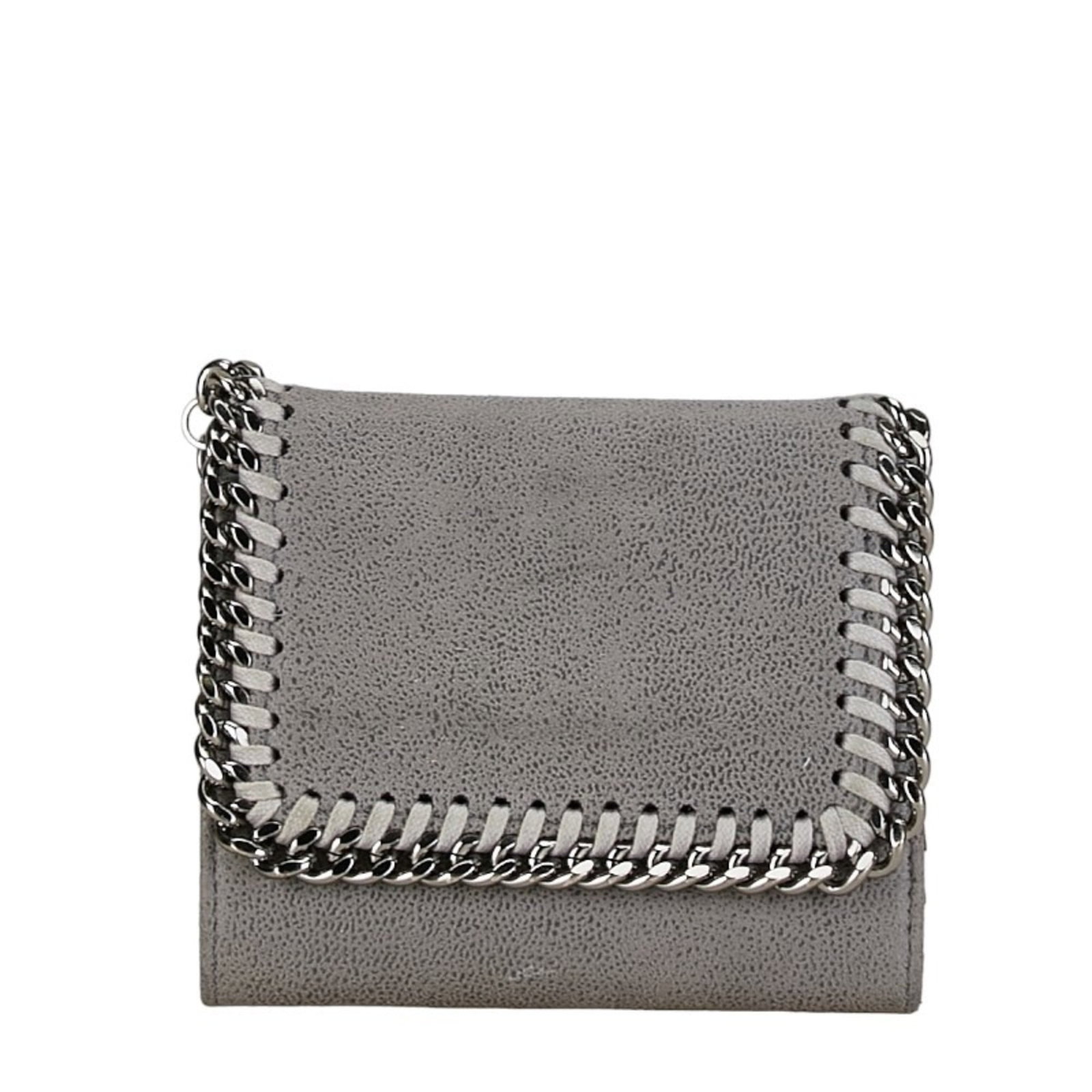 Polyester Bi Fold Wallet By Stella McCartney: Polyester Bi Fold Wallet By Stella McCartney Polyester bi-fold wallet by Stella McCartney, featuring a sleek gray design with clean lines and minimal ornamentation. Made from durable polyester materia