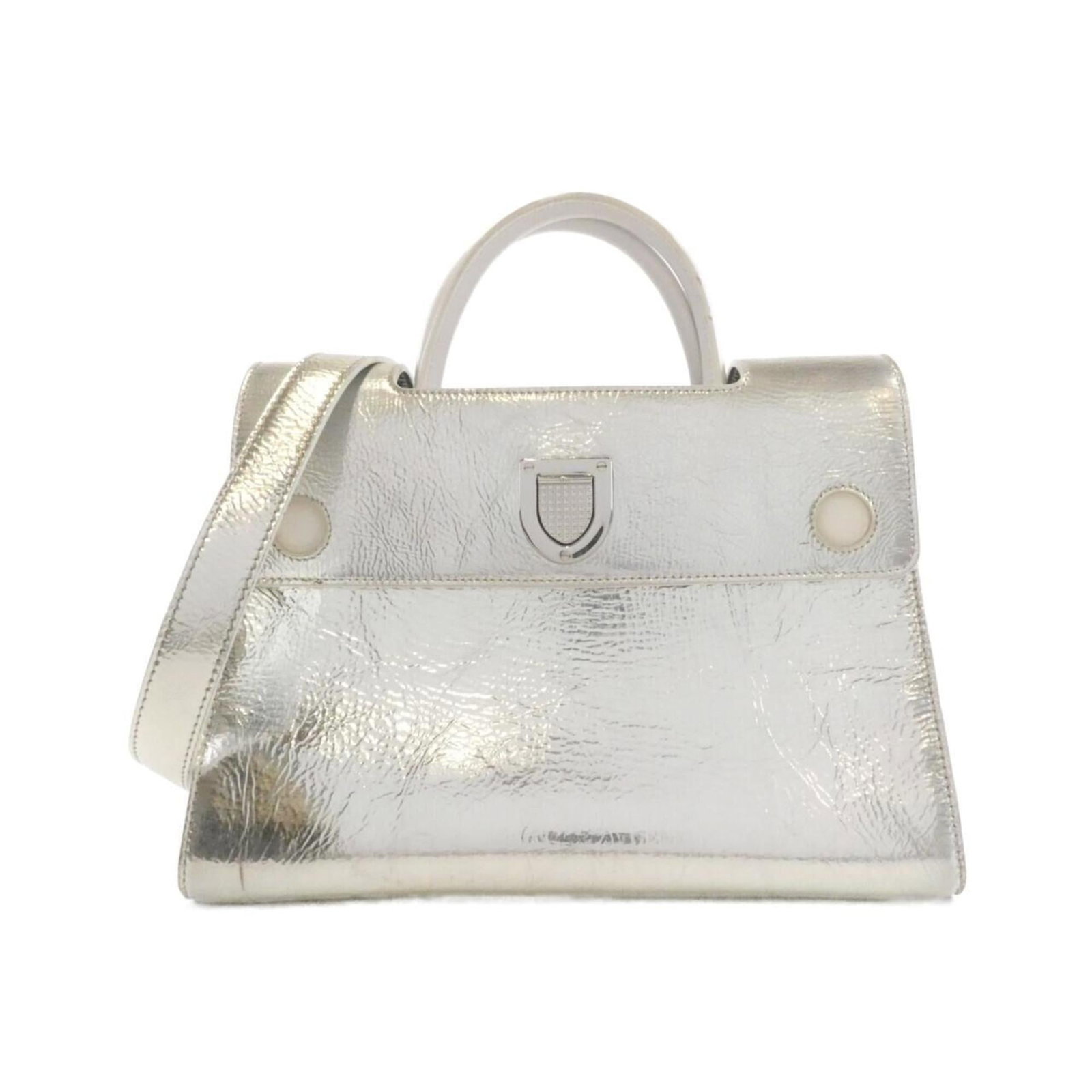 Handbag Christian Dior Leather: Handbag Christian Dior Leather This exquisite handbag from Christian Dior boasts sleek metallic and silver accents, set against a crisp white leather background. The elegant design features a sturdy