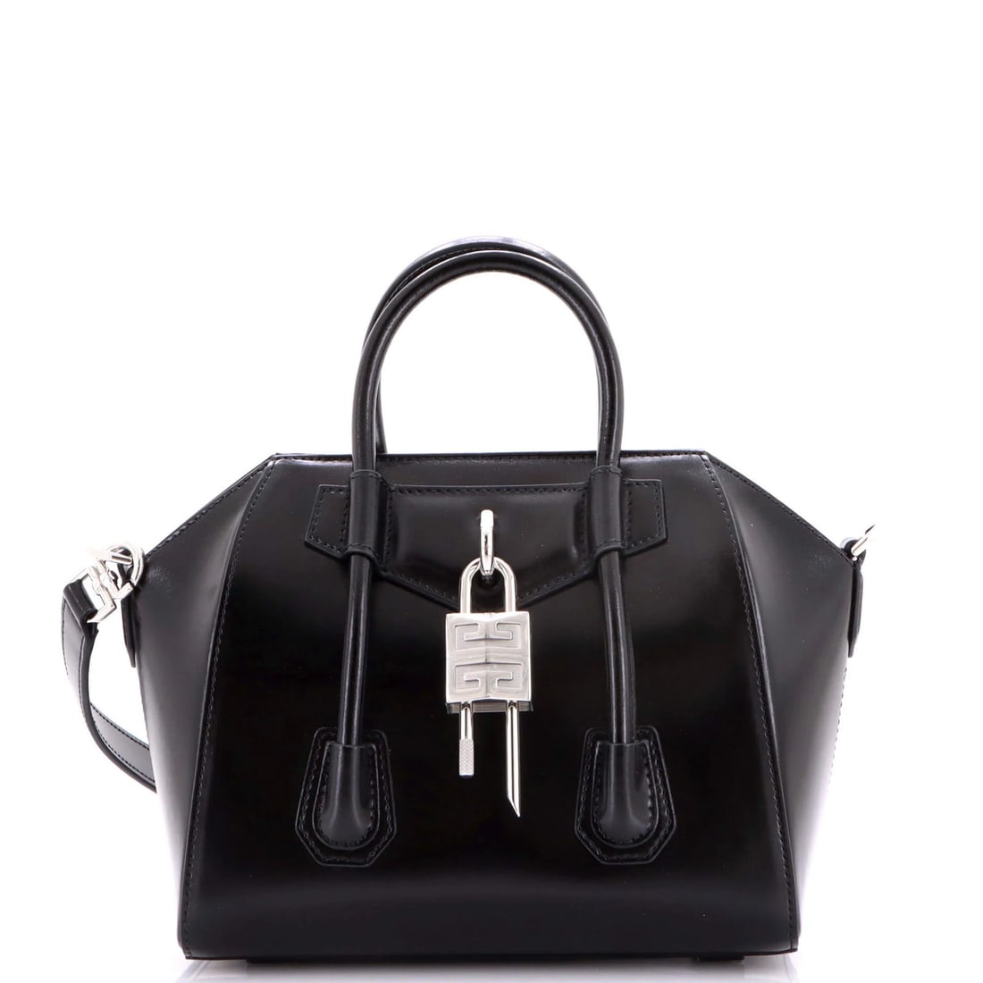 Givenchy Antigona Lock Bag Leather Mini: Givenchy Antigona Lock Bag Leather Mini Black leather mini cross body bag with silver hardware, featuring a lock with strap. Measures 3" drop handle, 7.5" height, 9" width, and 5" depth, with an adjus