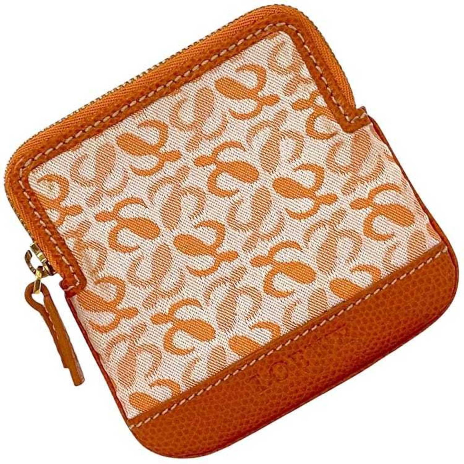 Loewe Coin Purse/ Coin Case Canvas Leather: Loewe Coin Purse/ Coin Case Canvas Leather Canvas and leather come together in this vibrant orange Loewe coin purse/coin case, measuring 9.5cm x 9.5cm x 1cm. The simple design showcases the quality of