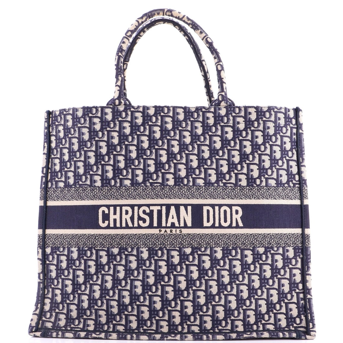Christian Dior Book Tote Oblique Canvas Large: Christian Dior Book Tote Oblique Canvas Large The Christian Dior Book Tote Oblique Canvas Large boasts a striking blue canvas exterior with clean lines and a classic design. Measuring 13.5" tall, 16" 