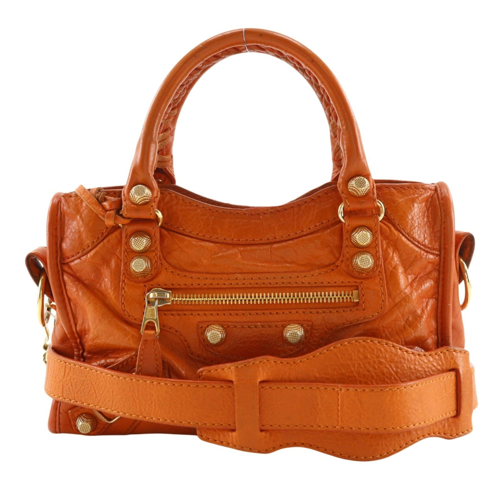 Balenciaga Handbag Leather: Balenciaga Handbag Leather The Balenciaga handbag features a vibrant orange leather exterior with a zipper pocket, making it a striking accessory. Its compact size and lightweight design make it easy 