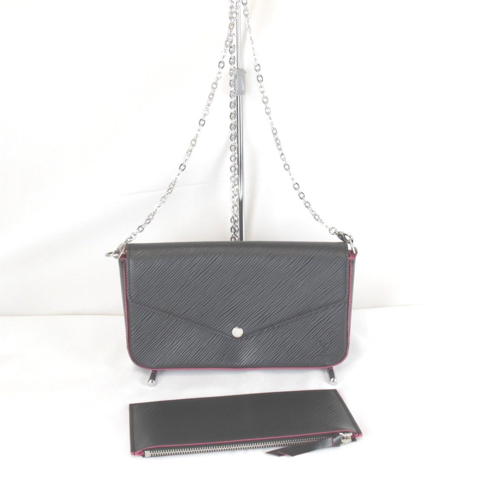 Epi Leather Pochette Pouch by Louis Vuitton: Epi Leather Pochette Pouch by Louis Vuitton Epi leather Pochette Pouch by Louis Vuitton, featuring a classic design with a black and pink color combination. This stylish pouch measures 12.5cm x 21cm x