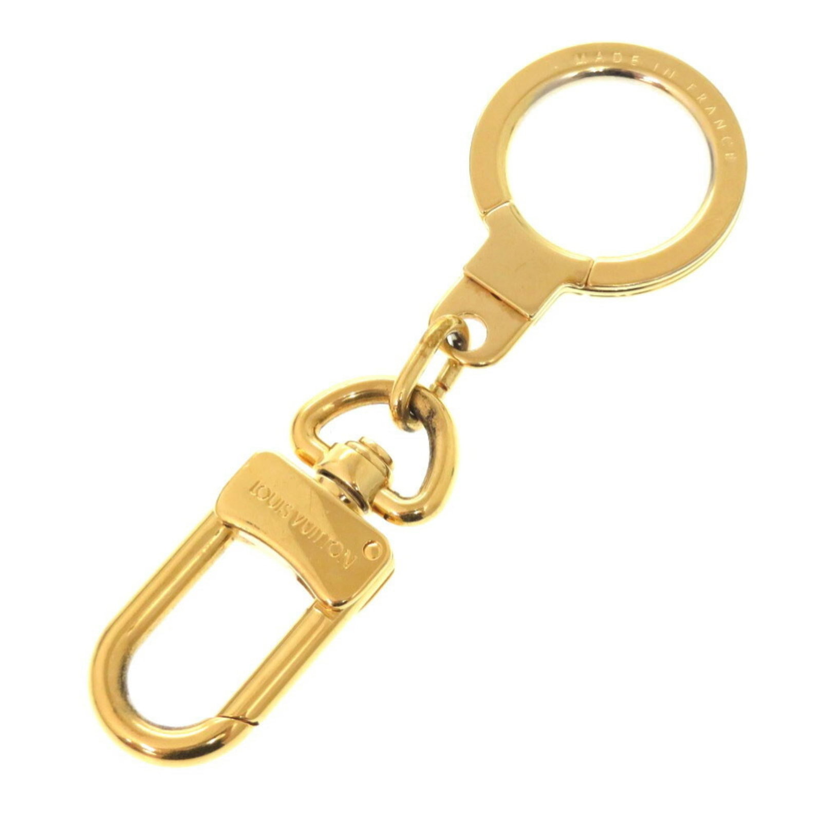 Metal keyring by Louis Vuitton: Metal keyring by Louis Vuitton Gold Metal Keyring by Louis Vuitton. A simple yet elegant accessory, this keyring features the iconic brand's signature metal material. The gold finish adds a touch of s