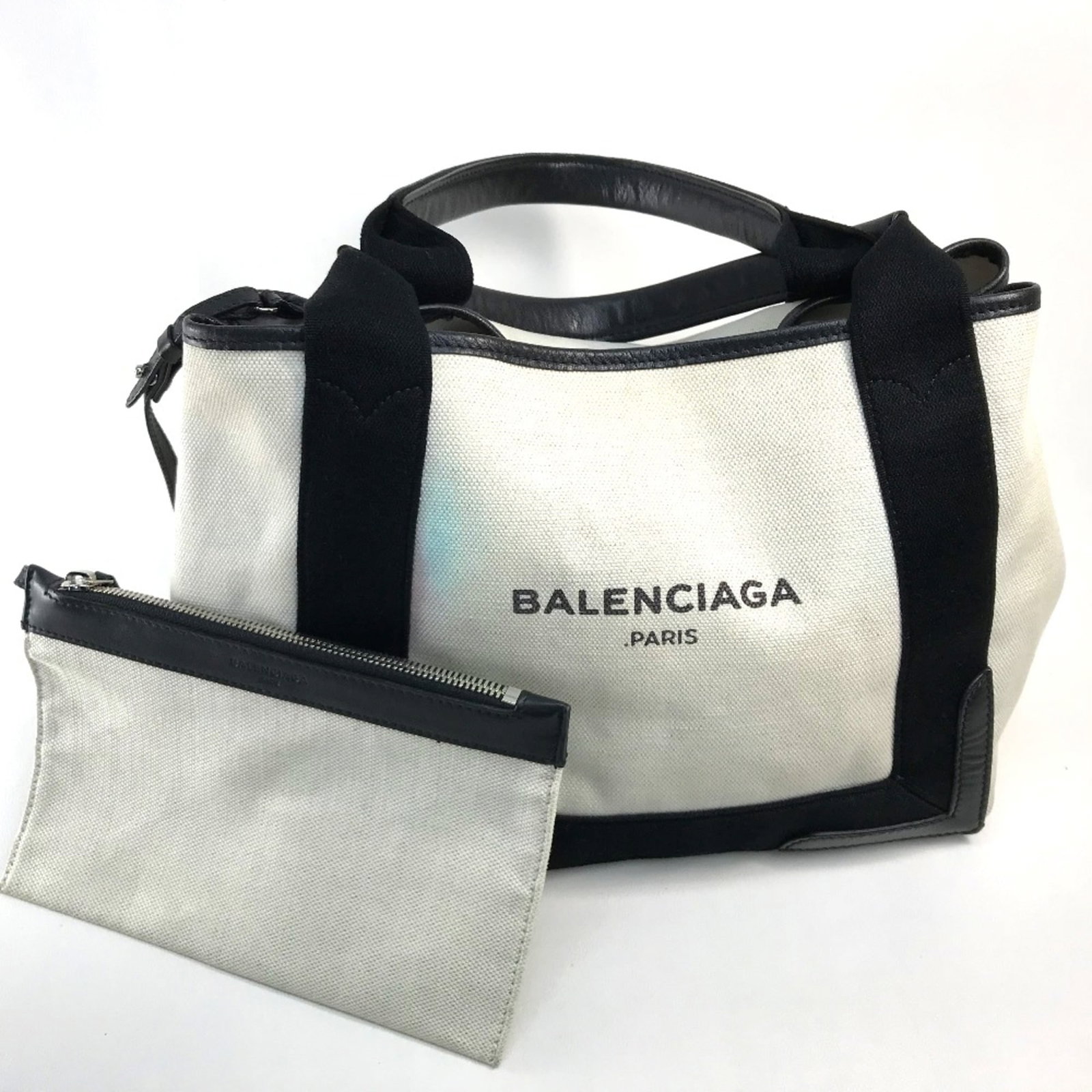 Handbag Other by Balenciaga: Handbag Other by Balenciaga White Balenciaga handbag with a zipper pouch, measuring 23cm x29cm x17.5cm, featuring an 8.3inchx Vertical 5.3inch zipper pouch at the bottom. The bag's dimensions are 9.1